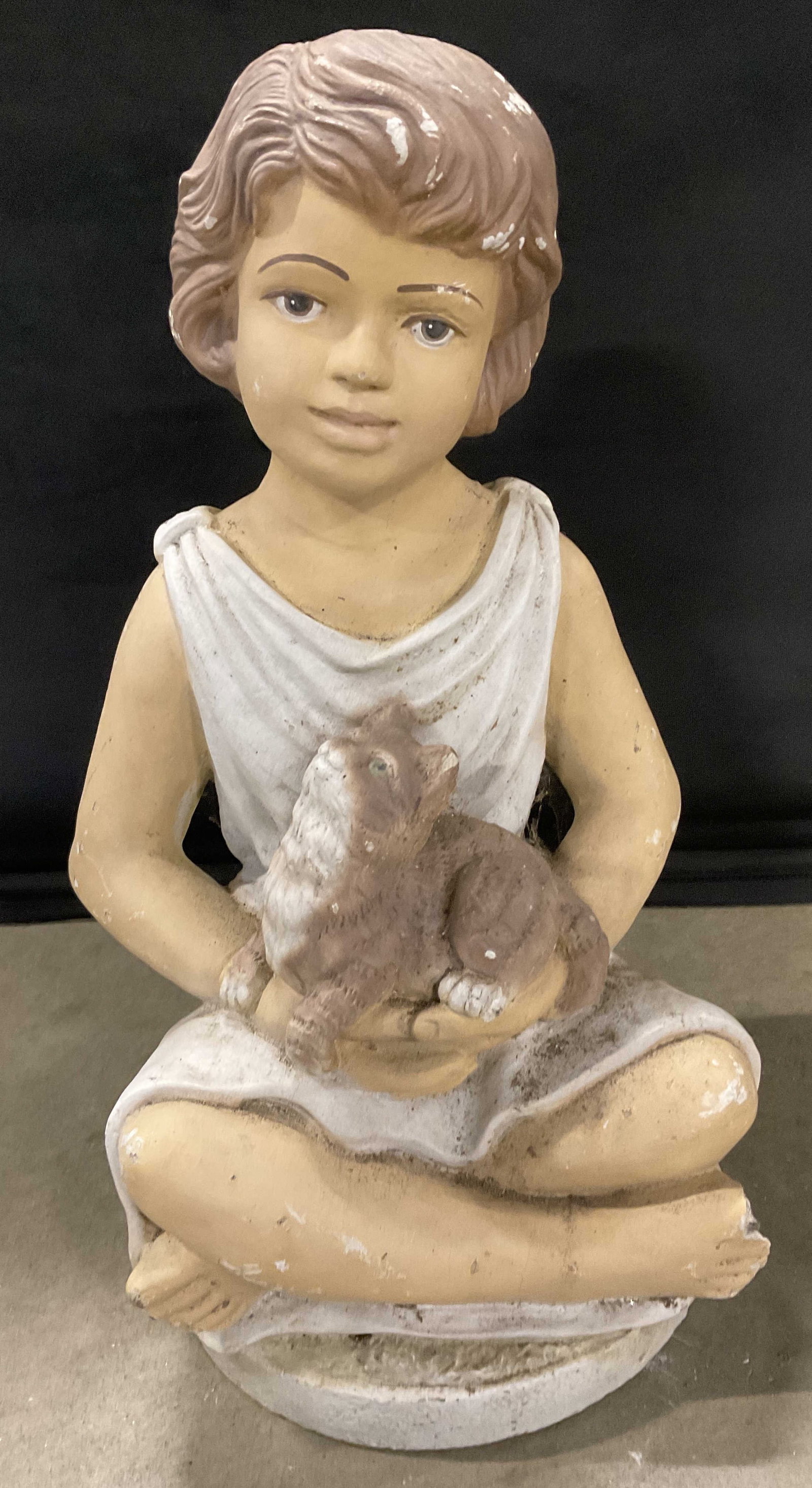 Vntg Signed Cast Stone Girl W/ Cat Garden Statuary: A vintage painted cast stone girl holding a cat garden statuary. Signed on reverse, worn, appears to read 77, 99, RELLIS. Measures approx. 17H x 10.5W x 8D in. Losses, chipping, discoloration, and sur
