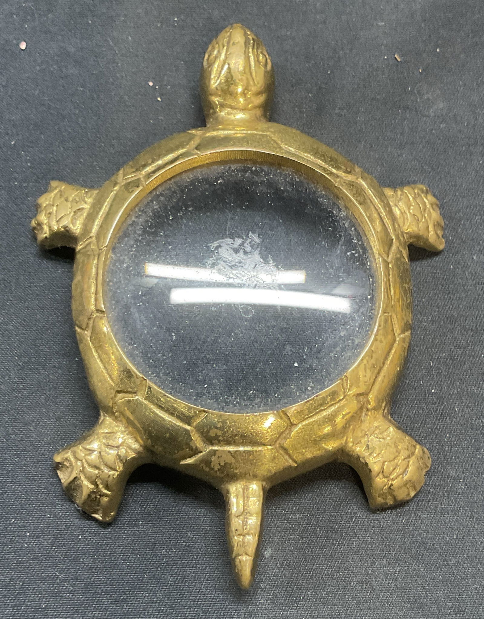 Brass Turtle motif Magnifying Glass: Brass turtle motif magnifying glass. Measures approx. 3.75 x 2.75 inches. Some surface wear including scratching observed. Magnifying glass, brass magnifying glass, turtle magnifying glass, collectibl