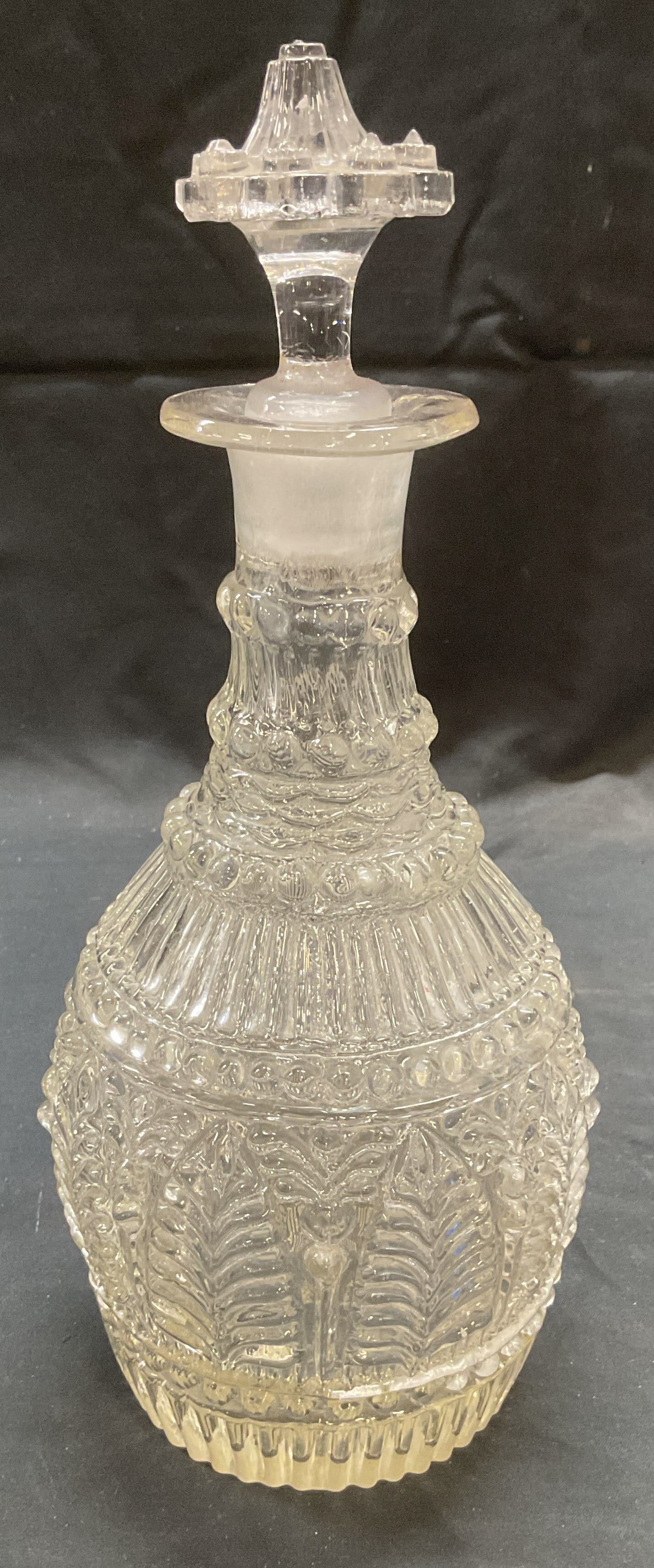 Vintage Hand Blown Glass Decanter: Vintage hand blown glass decanter with raised bead, stripe, and leaf pattern. Measure approx. 4.25 x 10.5 inches. Some surface wear including chipping on stopper and scratching observed. Decanter, han