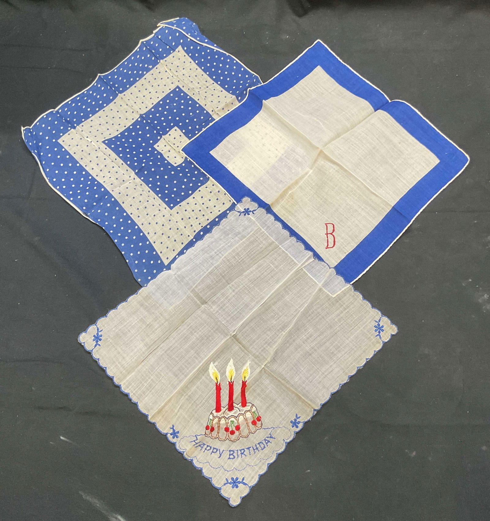 Lot 3 Vintage Blue & White Handkerchiefs: Lot of 3 vintage blue and white handkerchiefs. Embroidered Hally Birthday and cake motif, embroidered monogram B, and polka dot pattern. Largest measures approx. 10.5 x 10.5 inches. All pieces feel li