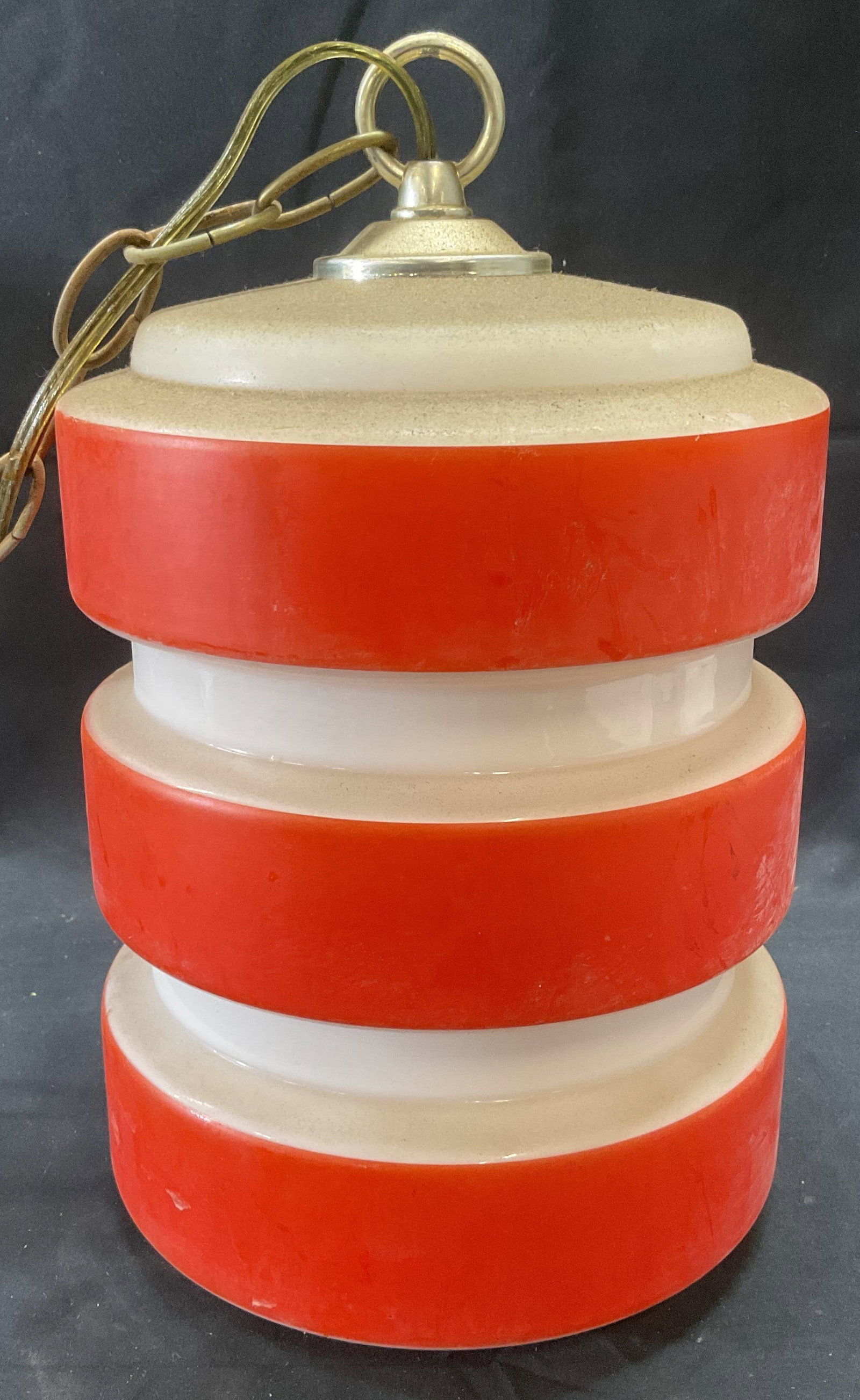 Vintage Orange White Striped Glass Pendant Lamp: Vintage orange and white toned striped glass pendant lamp. Measures approx. 7 x 10 inches. Not tested for function. Surface wear including scratching and residue on lamp and chain observed. Lamp, pend