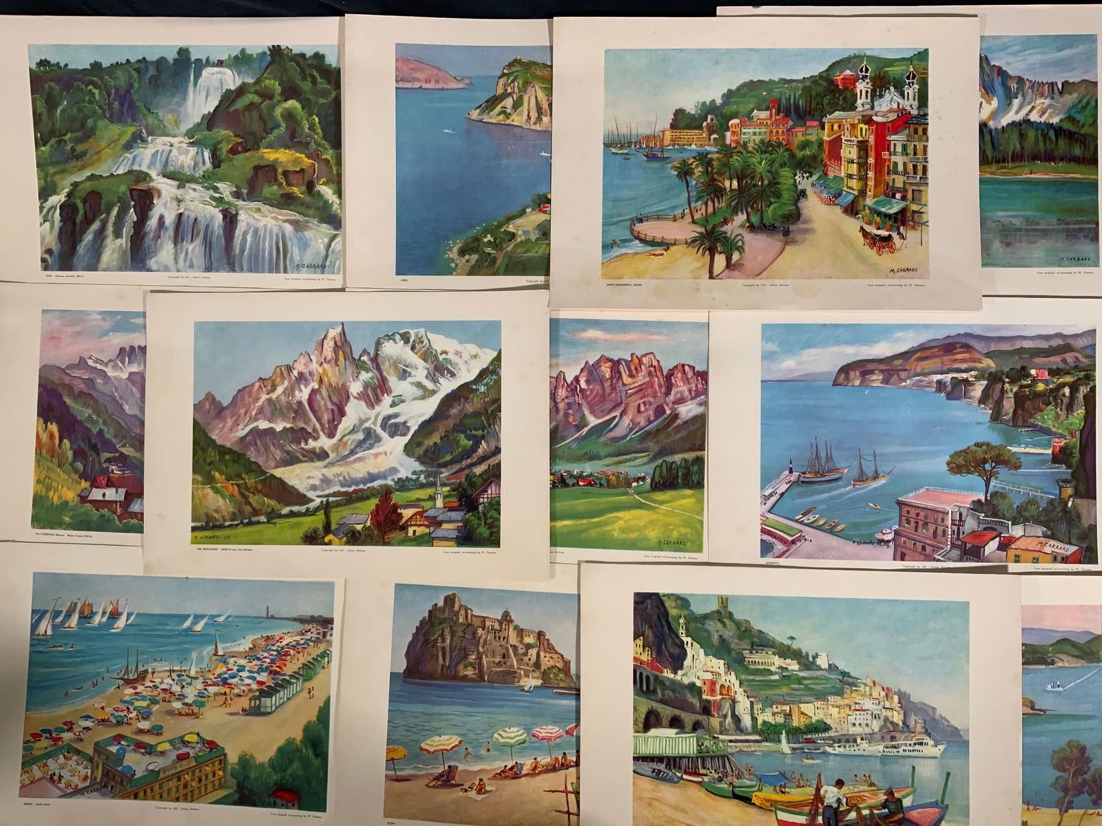After Mario Carraro European Landscapes Lithos: Lot 12 Offset Lithographs on paper. All lithographs after Mario Carraros works. Copyrighted by LAI - Italian Airlines. Subjects depict different European and Mediterranean landscapes and cityscapes. I