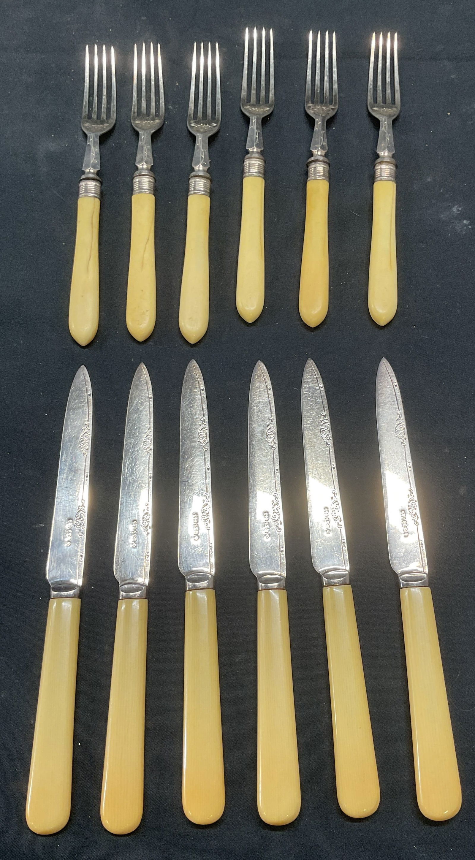 Lot 12 Edwin Blyde Silver Pl Faux Bone Knives +: Lot of 12 pieces of flatware. Vintage Edwin Blyde & Co faux bone handle knives with silver plated blades. Decorative etched scroll motifs. Signed ED & Co S. Measure approx. 7.5 inches long. Vintage fa