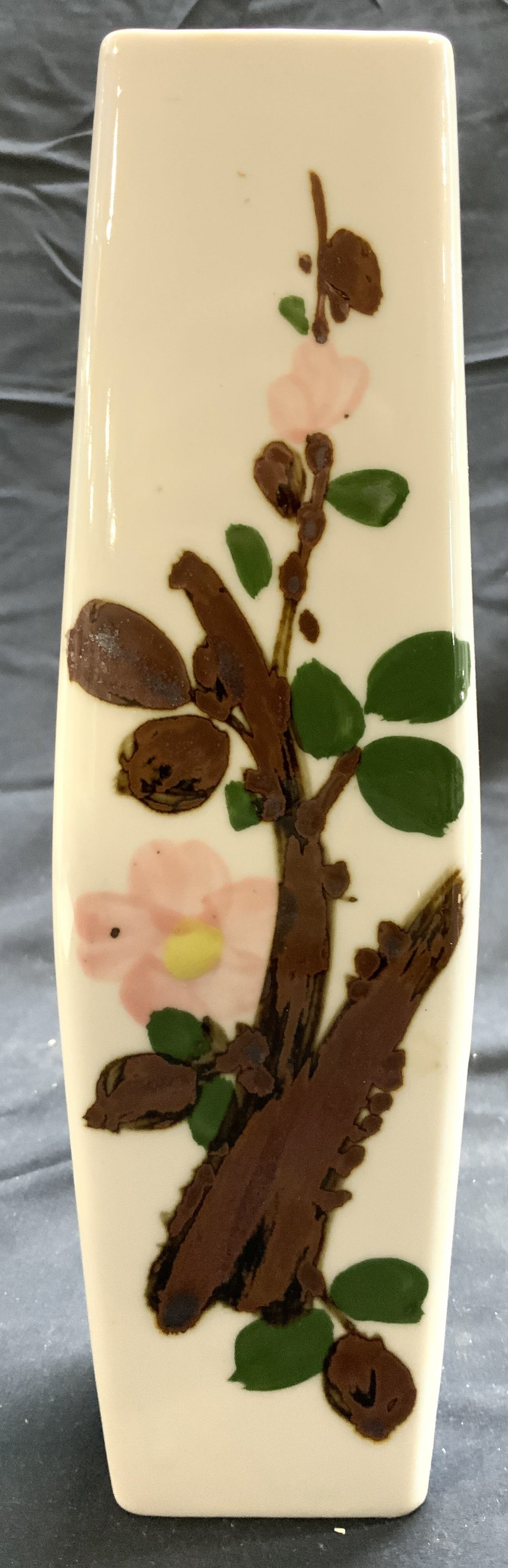 Hand Painted Porcelain Vase Vessel: Vase is white toned and porcelain. Piece has multi toned floral, leaf, branch and blue detail at sides. Vase expands slightly in center. Piece measures approximately 9.75 inches tall 2.75 inches wide.