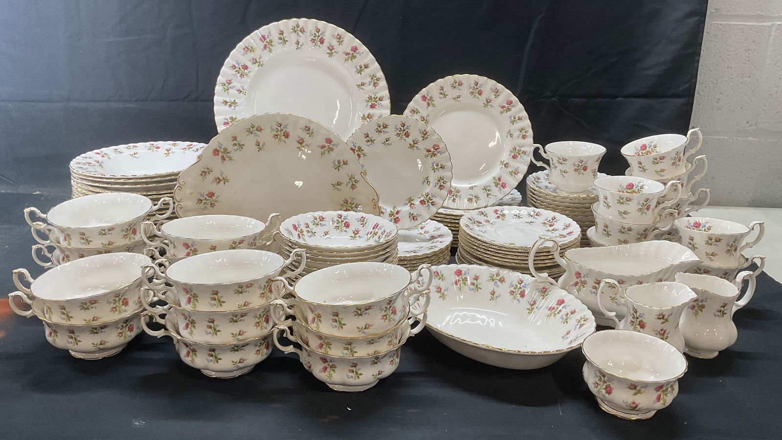Set 117 Royal Albert Winsome China, England: Set of 117 pieces Royal Albert bone china dinnerware in Winsome pattern. White with pink floral pattern and gilt decoration. All pieces trademarked to undersides. Made in England. Set includes 11 dinn
