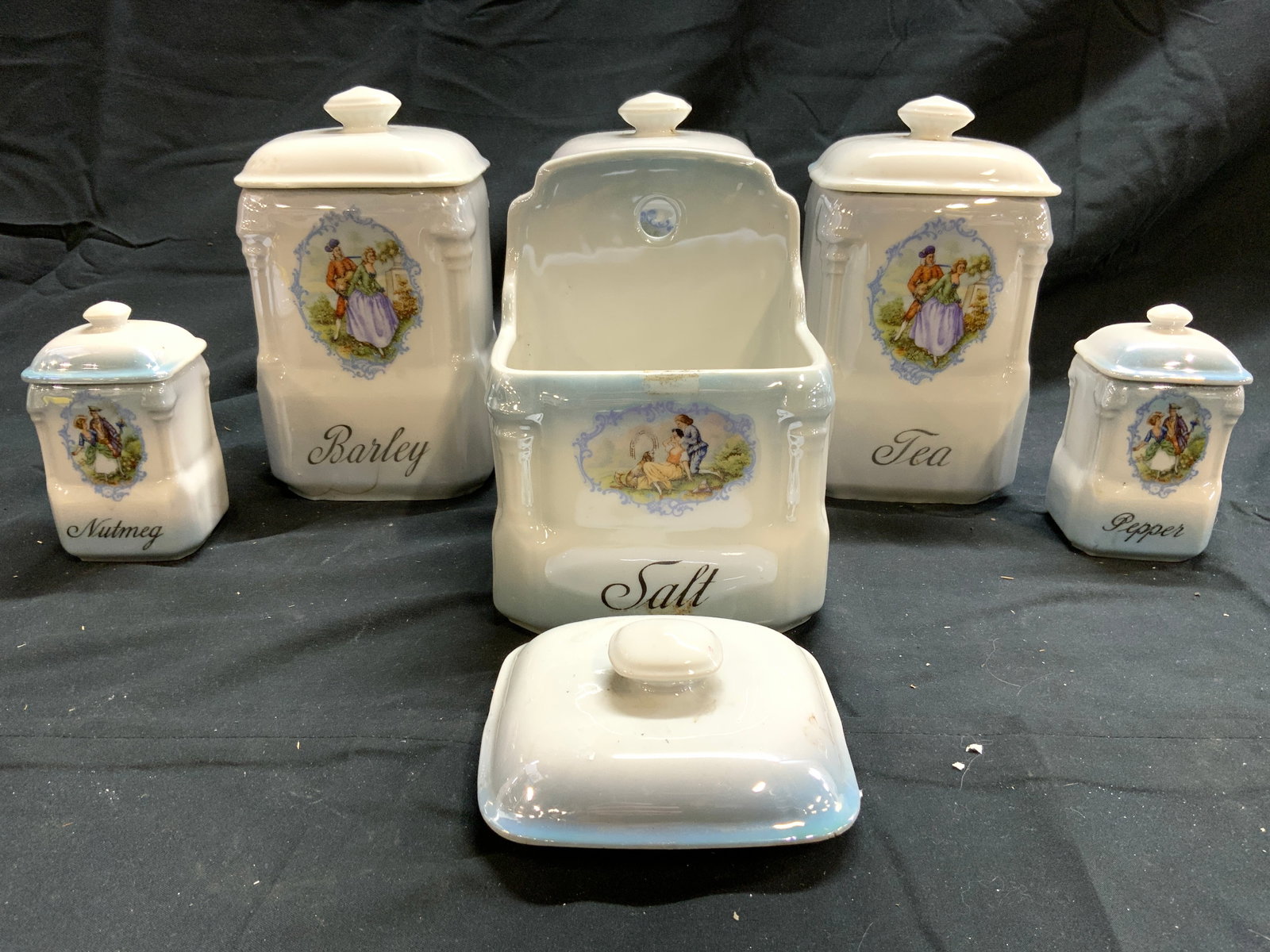 VICTORIA CHINA 7 Porc Jars W Lids CZECHOSLOVAKIA: Undersides are marked VICTORIA CHINA CZECHOSLOVAKIA. Lot includes 1 tea, 1 salt, 1 coffee, 1 barley, 1 nutmeg, 1 pepper jar & 1 lid. Each vessel includes lids excluding Salt container. Each piece is w