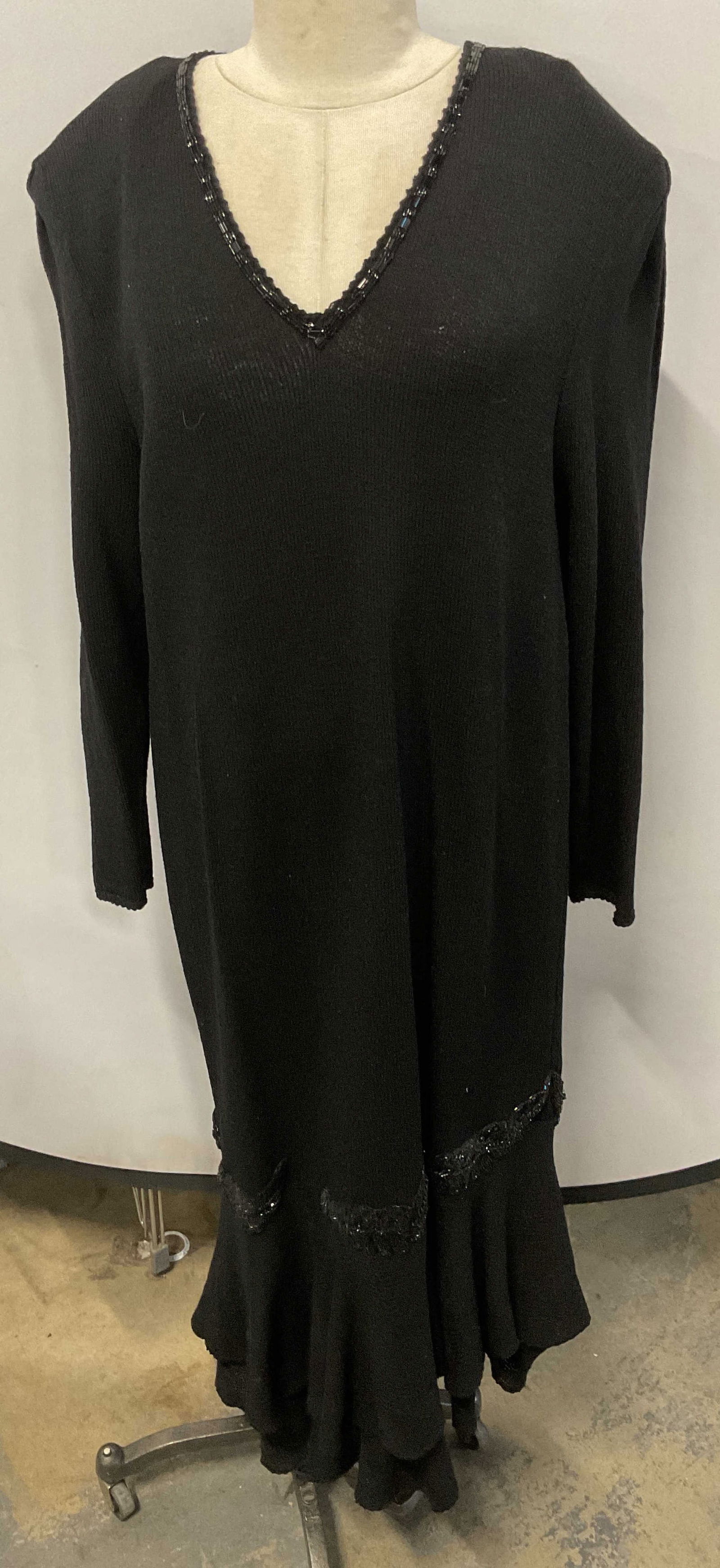 Vera Porter Knit Black Beaded Dress: Vera Porter knit black dress with beaded decoration. Material feels like wool. Measures approx. 22 inches across chest. Some wear to material and loss to beading consistent with exposure. Vera Porter,