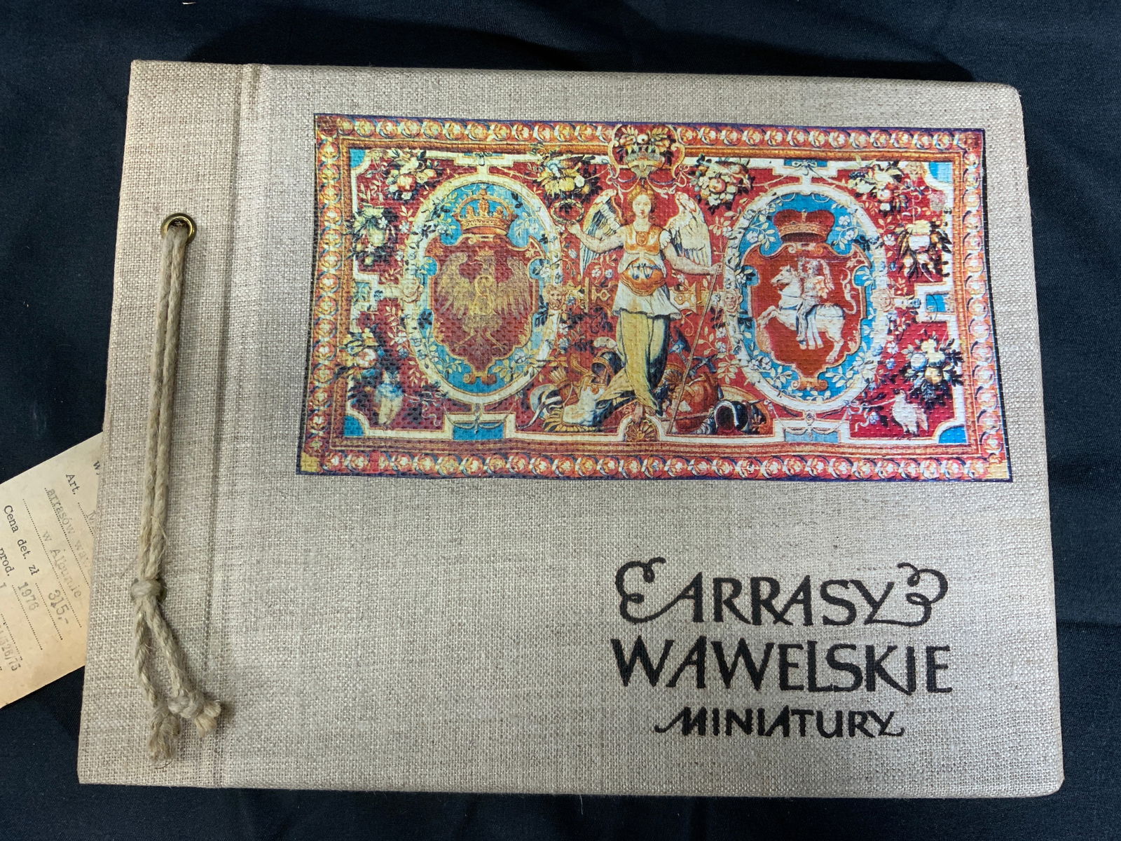Arrasy Wawelskie Minituary Tapestries Book: Book titled Arrasy Wawelskie Minituarys. Book is filled with miniature versions of tapestries. Tapestries are lithographs affixed to pieces of fabric. Text on each page with information about the tape