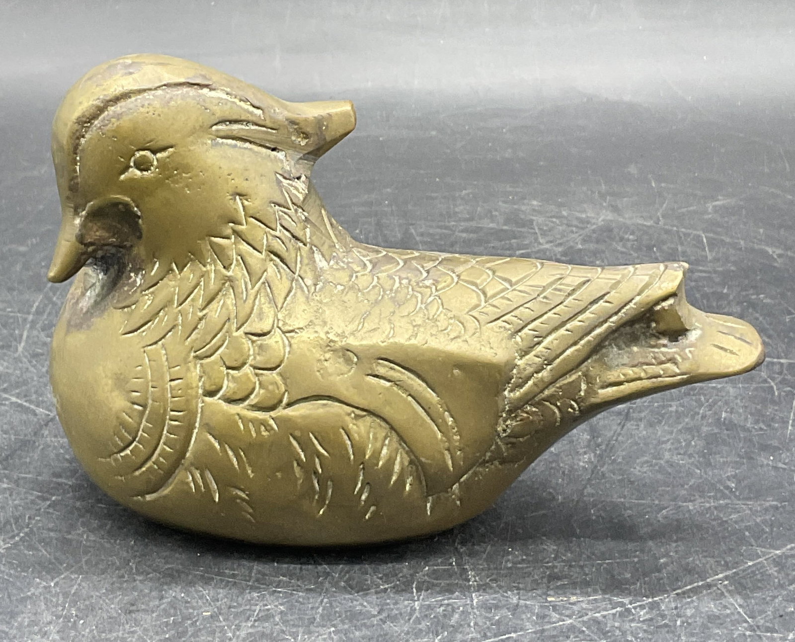 Vintage Mid Century Modern Brass Duck Figural: A vintage mid century modern brass duck figural. Measures approx. 3.5H x 5.25W in. Some discoloration and surface wear present. Sticker residue to underside. home decor, home accents, homewares, house