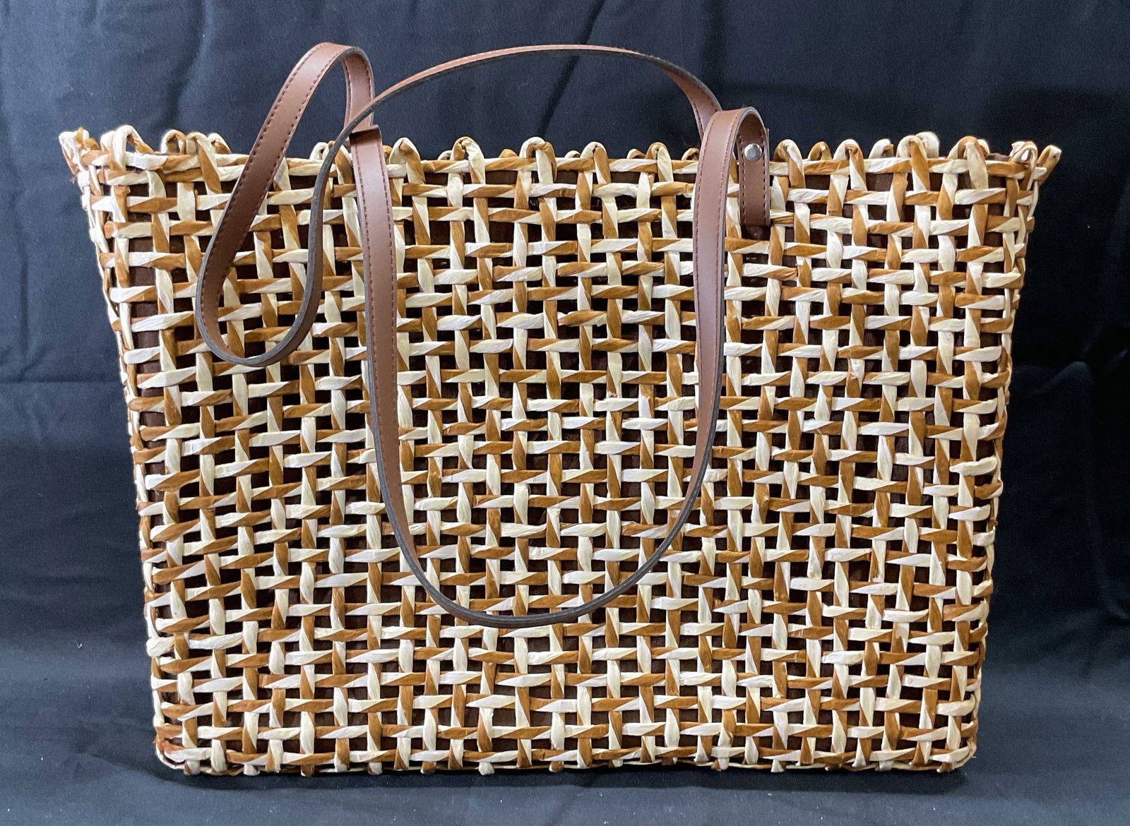Lancome Woven White & Brown Straw Handbag: Lancome Woven white and brown straw handbag with brown fabric lining. One pocket to interior. Measures approx. 15 x 4 x 11.5 inches. Some wear to material consistent with exposure. Ladies handbag, lad