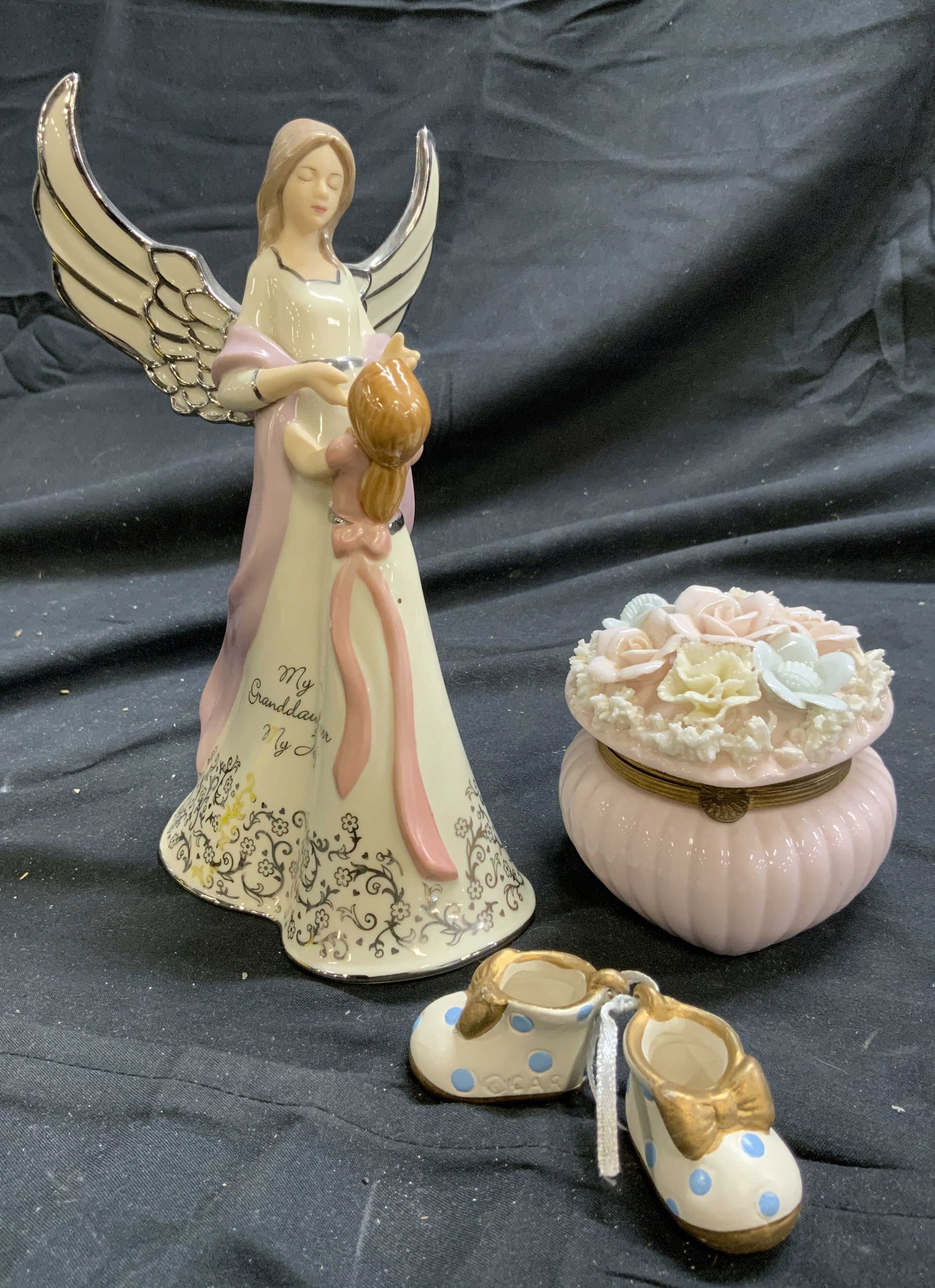 Lot 2 Porc Angel & Trinket Box: Lot includes 1 porcelain angel and girl figure which read MY GRANDDAUGHTER MY JOY & 1 Porcelain trinket box with pair of porcelain shoes inside. Trinket box is scalloped, pink with multi toned floral 