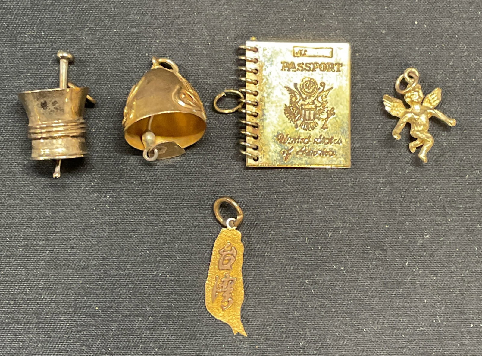 Lot 5 Vntg 18k Gold Asian Pendant, 10k Cherub +: Lot of 5 vintage pendants/charms. 18k gold pendant with raised Asian characters. Marked 18k. Measures approx. .75 inches long. Total weight 0.5 dwt. 10k gold cherub motif charm. Marked 10k, FC. Measur