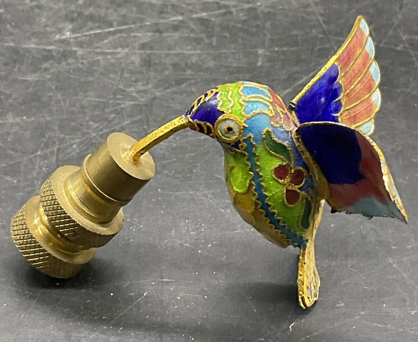 Enameled Hummingbird Figural Finial: A enameled hummingbird figural finial. Measures approx. 2.25H x 1.75W in. Some crazing to the enamelwork and surface wear present. home decor, home accents, homewares, housewares, home accessories, co