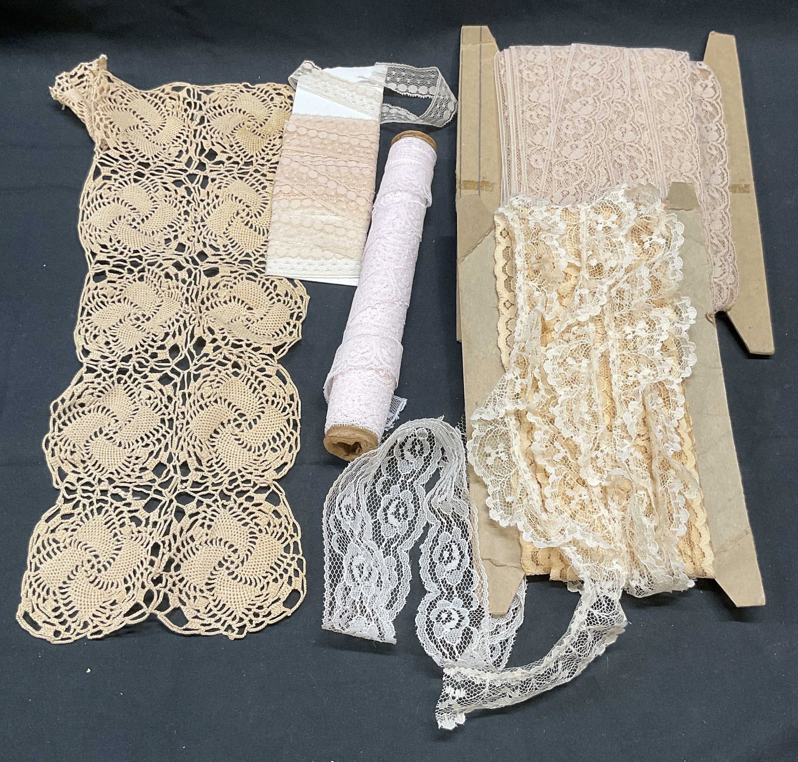 Group Lot Vintage Lace Ribbon Trim: Group lot of vintage lace ribbon trim. White, beige, cream, and light pink. Varying lengths. Widest approx. 5 inches, narrowest approx. .75 inches. All pieces have some wear consistent with exposure. 