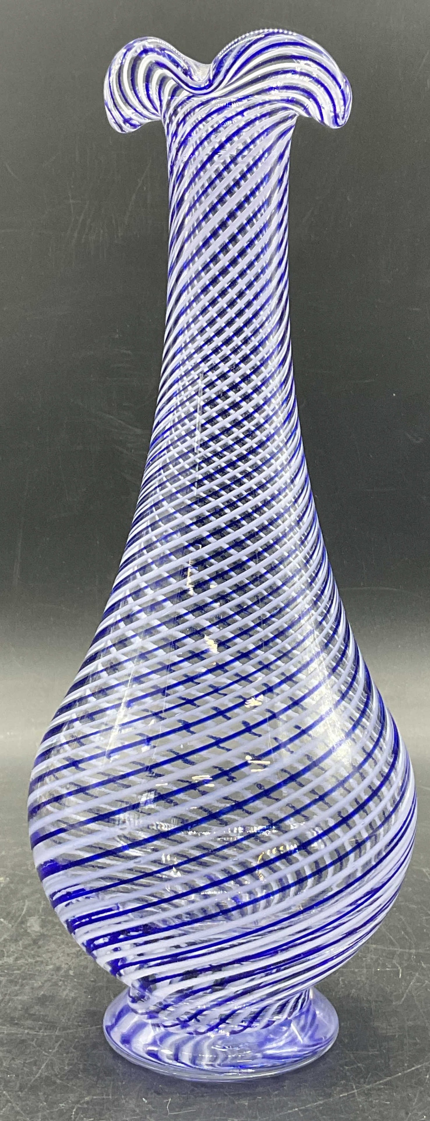 Vintage Blue Swirl Art Glass Ruffle Rim Vase: Appears to be a Turkish Cesm-i Bulbul Vase. A vintage blue swirl art glass ruffle rim vase. Measures approx. 10H x 3.5W in. Pontil to underside. Some surface wear consistent with age, use, and exposur