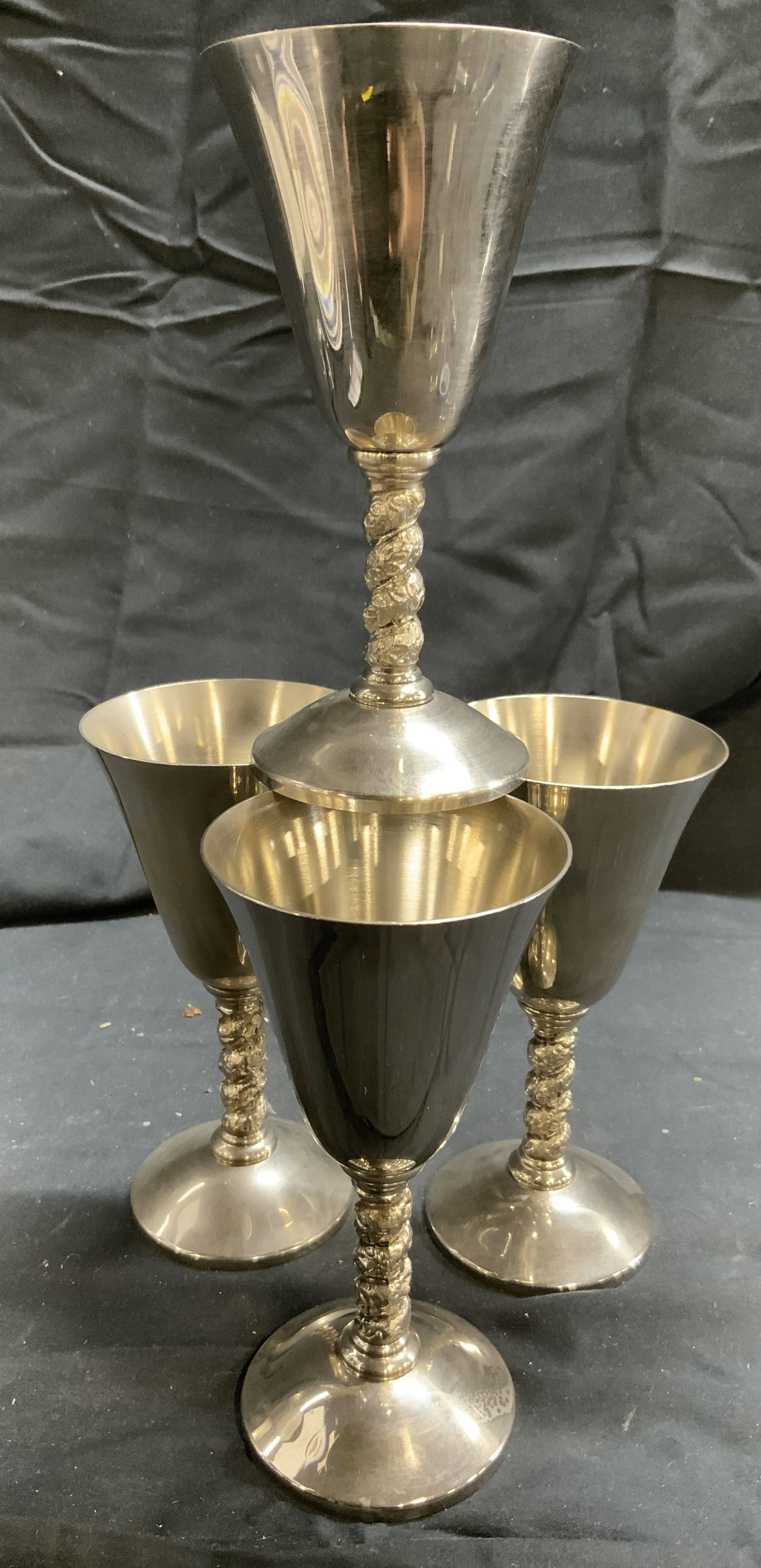 ROMA SL EPNS Set 4 Wine Goblets SPAIN: Undersides are inscribed ROMA SL EPNS (Electro Plated Nickel Silver) MADRID SPAIN . Lot includes 4 wine goblets. Each are silver toned. Each piece has leaf detail wrapping around stems. Vessels each m