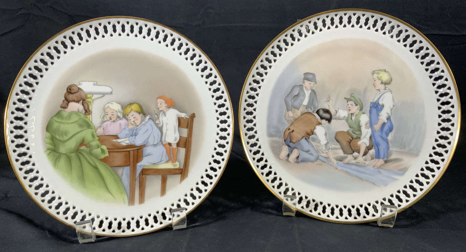 Lot 2 Hans Christian Andersen Porcelain Plates: Lot 2 Hans Christian Anderson Plates. Both plates are Copenhagen Porcelain, Made in Denmark. One plate titled The Darning Needle. Pencil drawing by Vilhelm Pederson. Subject depicts a group of kids ar