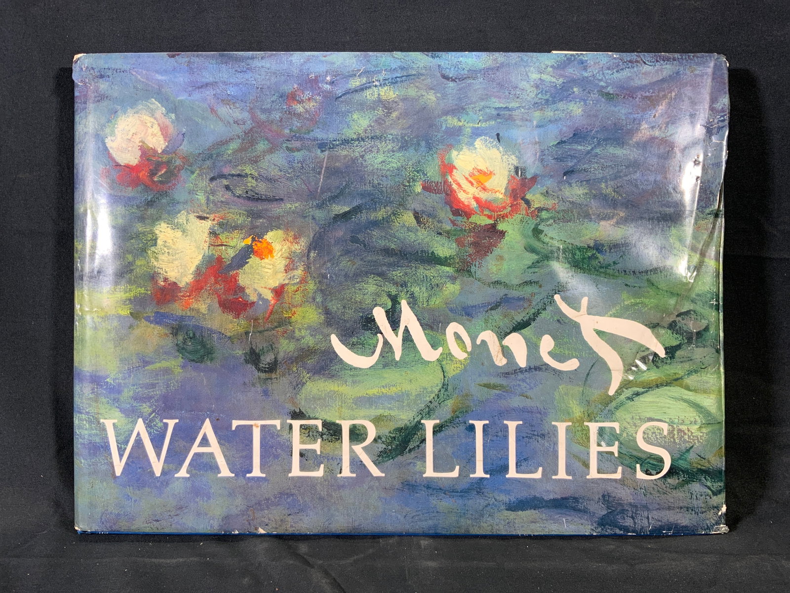 Monet Water Lilies Charles F Stuckey Book 1998: Large art book. Titled Monet Water Lilies by Charles F. Stuckey. Published by Macmillan New York, 1998. Printed in Japan. Water Lilies Monet includes Monets famous paintings from Giverny, France. Also