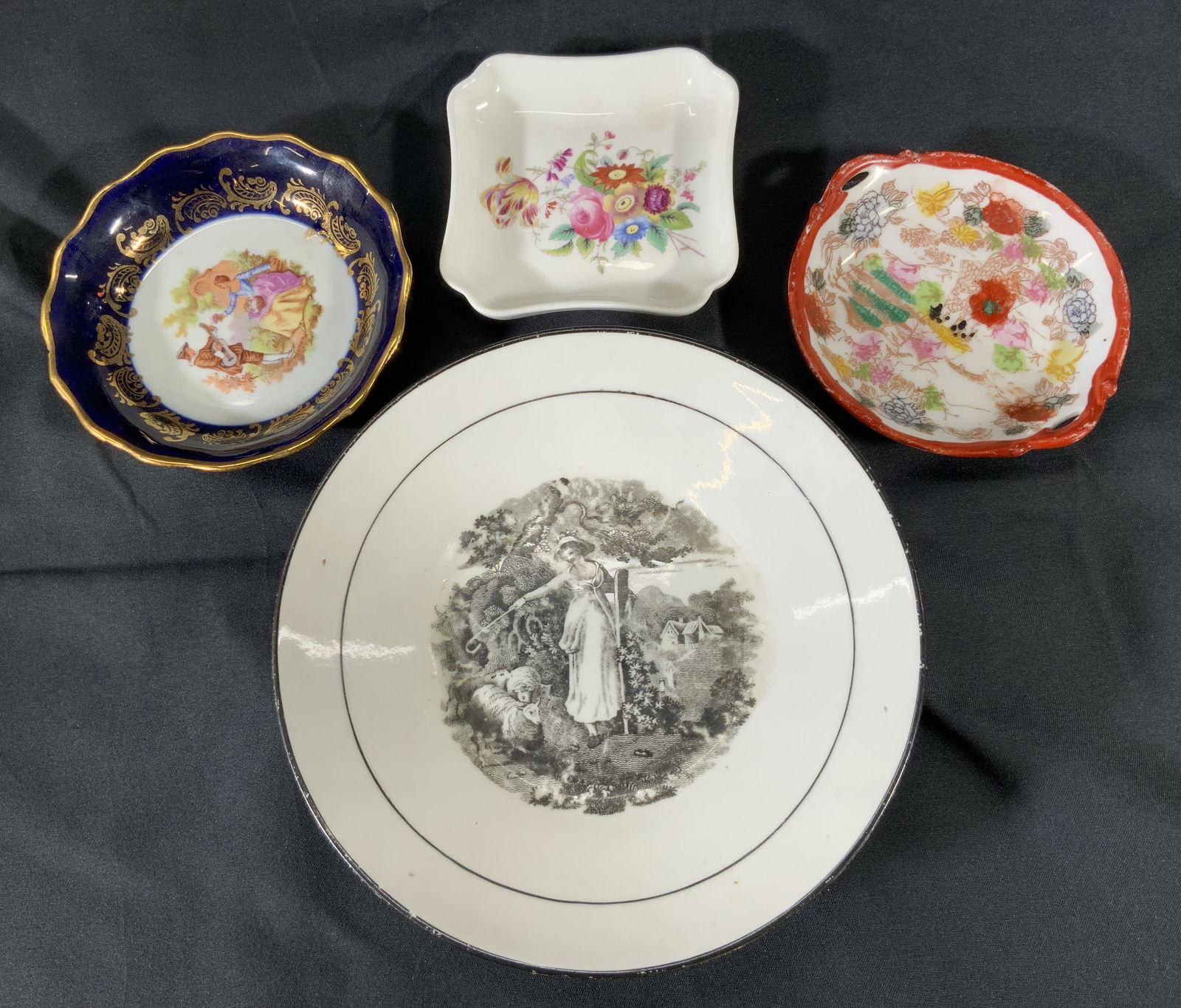 Lot 4 Ceramic & Porcelain Trinket Dishes England+: Lot 4 trinket dishes. Largest dish measures approx. 6 n. Largest dish has a motif of a woman directing sheep. Square dish bone china made in England with floral motif in center. Circular dish with sma