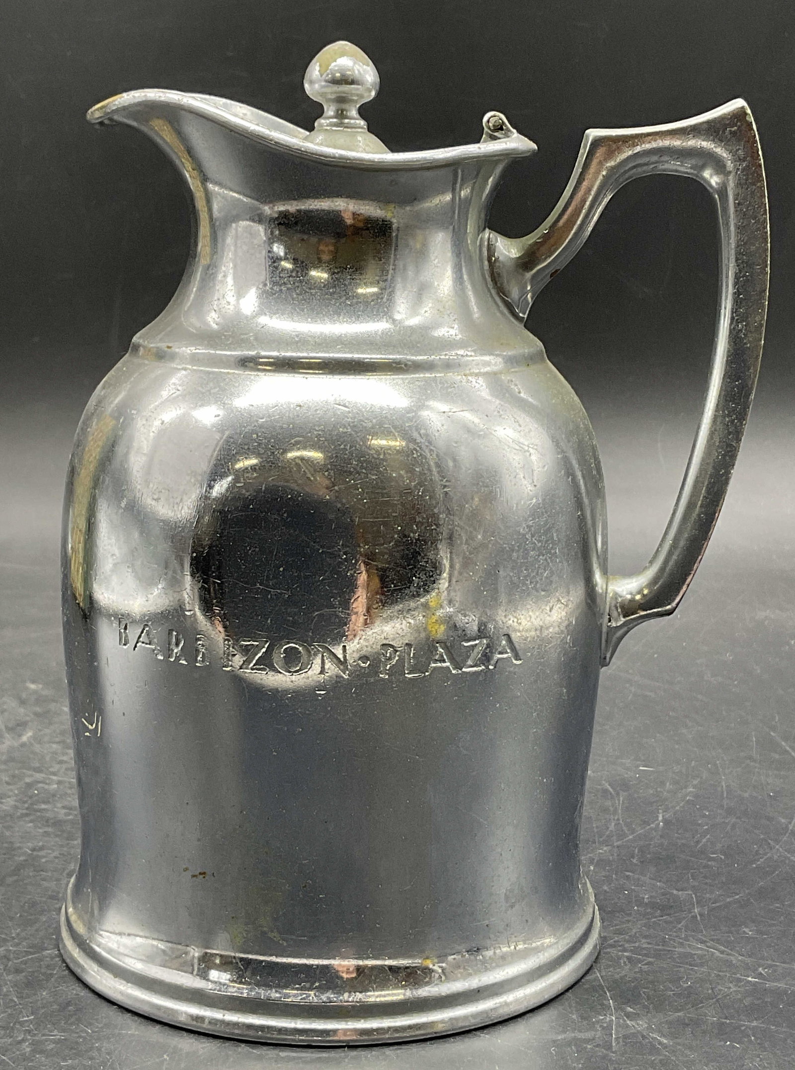STANLEY USA Vintage Barbizon Plaza Metal Pitcher: STANLEY USA Vintage Barbizon Plaza Metal Pitcher. Lidded. The lid opens with hinge hardware. Measures approx. 5W x 6.25H in. Measurement includes spout and handle. Underside reads STANLEY USA, LANDERS