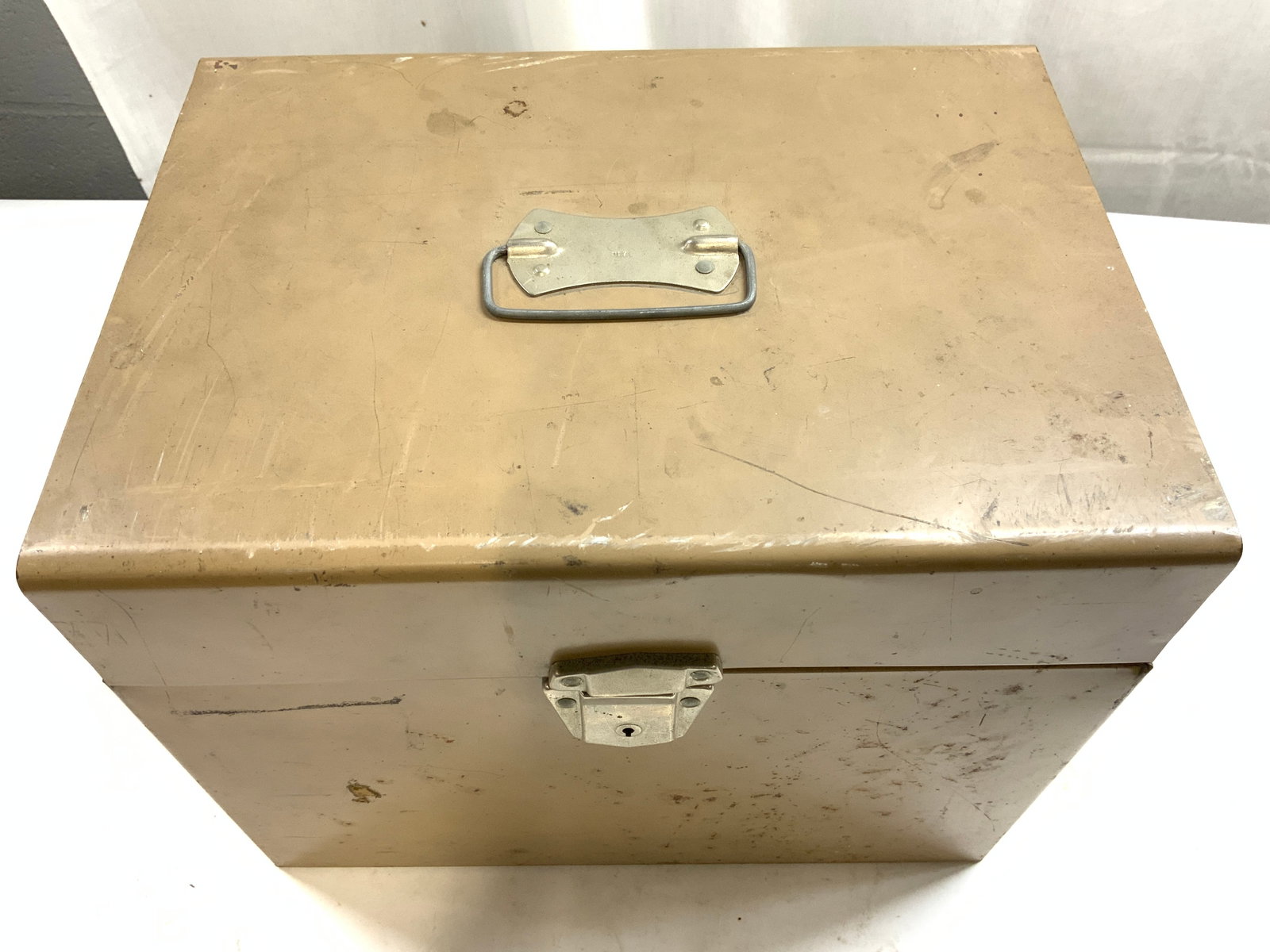 Vintage Metal Filing Case W Lid & Handle: Filing case is vintage and metal. Piece is beige toned. Filing case has hinged lid. Piece has silver toned locking mechanism and handle. Interior is divided into 2 sections. Piece measures approximate