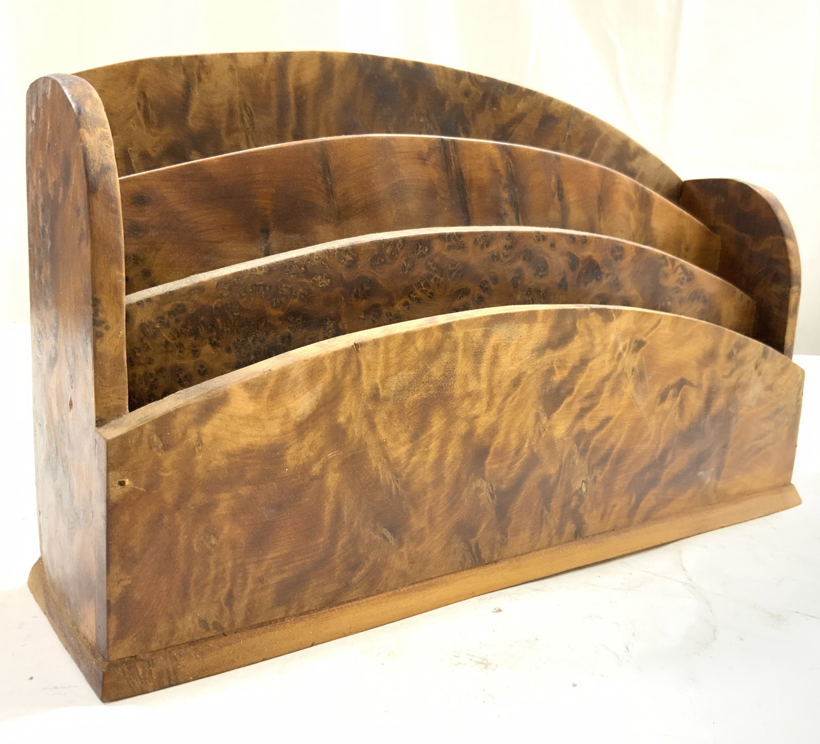 Art Deco Burlwood Letter Rack: Letter rack is tan toned Burled wood. Piece is divided into 3 sections. Letter rack is art deco. Piece has slight arch form. Letter rack measures approximately 11 inches wide 6.5 inches tall 3 inches 