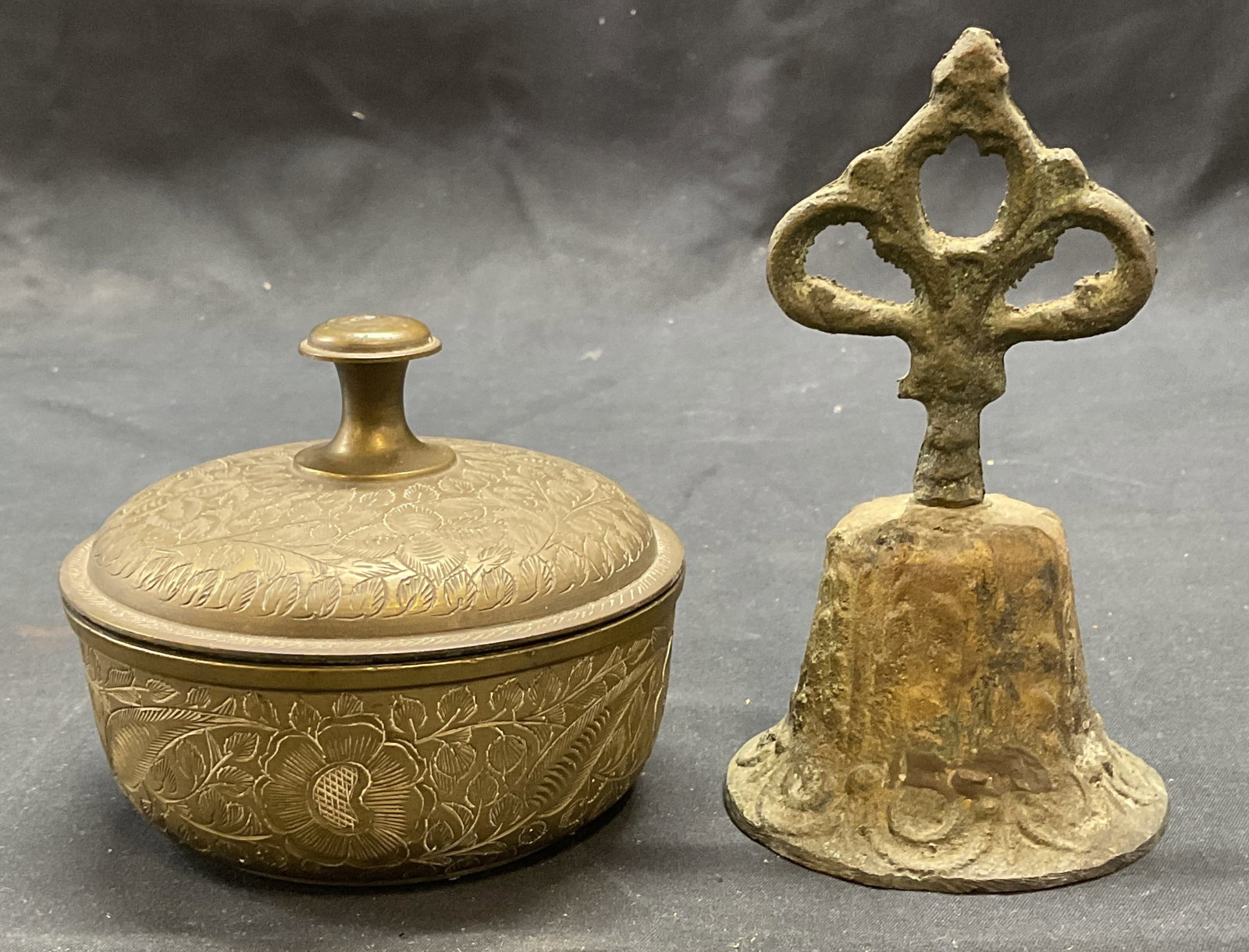 Lot 2 Vintage Brass Lidded Bowl & Bell: Vintage brass bowl with lid. Ornate etched floral pattern. Measures approx. 4 x 3.25 inches. Vintage brass bell with raised scroll pattern. Measures approx. 3 x 5 inches. Both pieces have surface wear