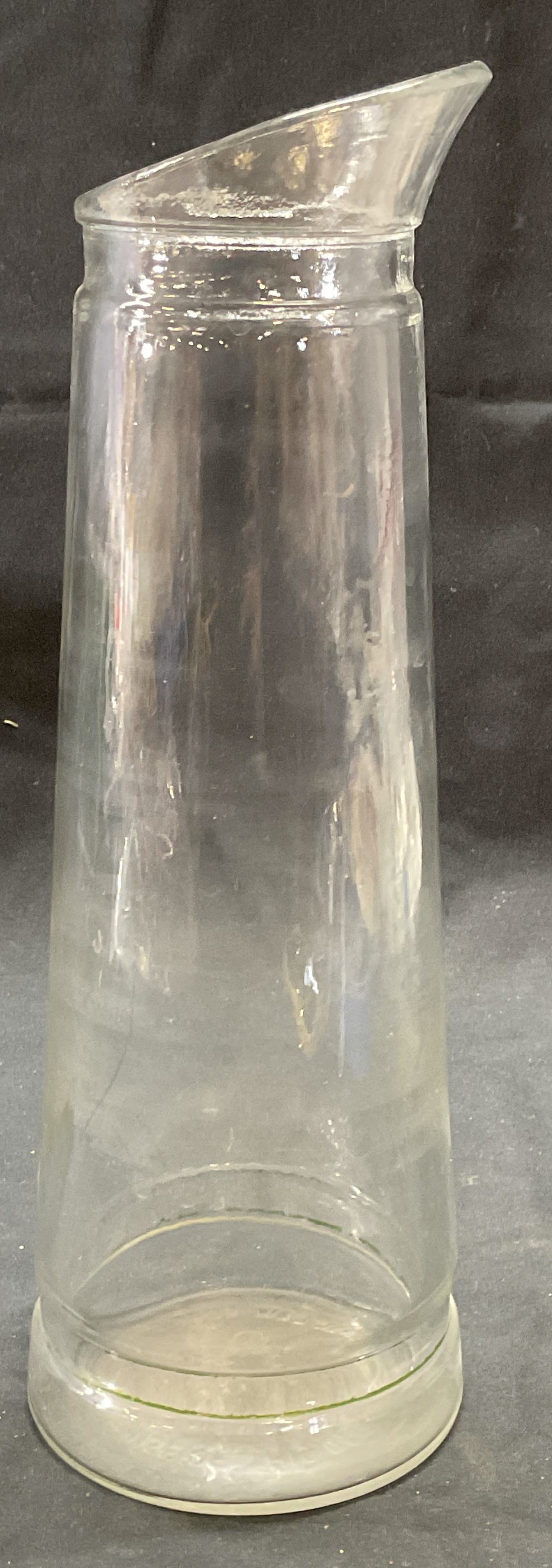 Vintage Glass Alcohol Bottle Carafe: Vintage glass alcohol bottle/carafe. Embossed Federal Law Forbids Sale or Re Use of This Bottle on underside with additional markings. Circa 1930s-1960s. Measures approx. 3.5 x 10.5 inches. Some surfa