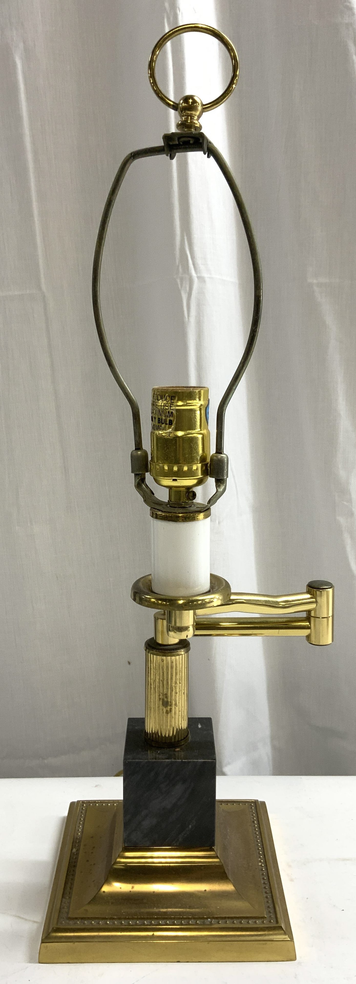 Vntg Gilt Metal & Marble Rotating Arm Lamp: Lamp is vintage. Piece has gilt metal and marble base. Lamp has rotatable arm. Piece includes harp and finial. Lamp has square form base. Lamp measures approx 20.5 inches tall 7 inches wide. Lamp, vin