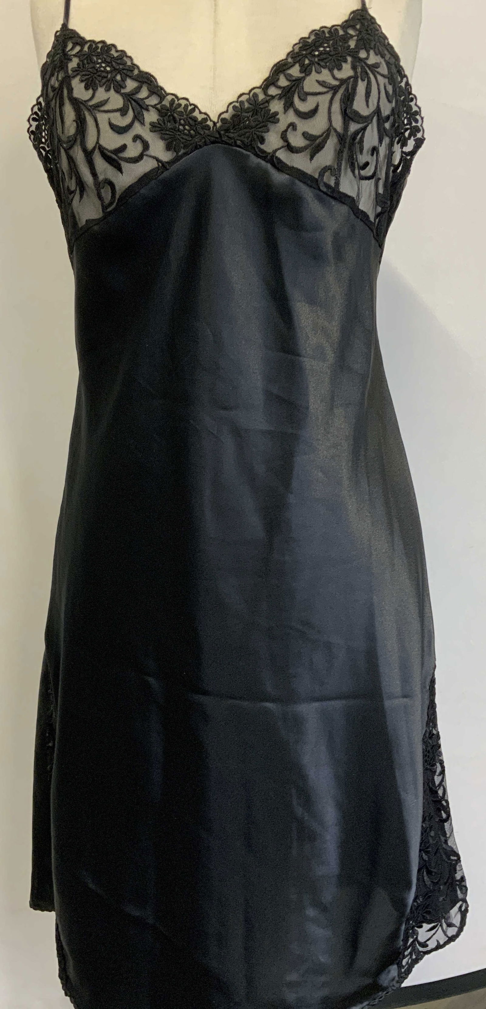 Neiman Marcus Black Satin Lace Slip Dress: Black Satin lace slip dress. Brand name is Neiman Marcus. Size 36. 100% polyester. Bust and sides of dress are only lace. Adjustable straps. Minor wear to fabric. Womans apparel, womans clothing, blac