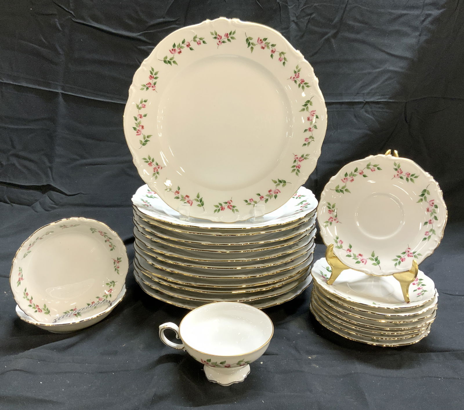 CROWN BAVARIA Set 23 Porcelain Serveware: Undersides are trademarked CROWN BAVARIA GERMANY. Set includes 12 dinner plates, 8 saucers, 2 dessert bowls & 1 teacup. Each piece is white with pink & green toned floral, vine & leaf detail. Each pie