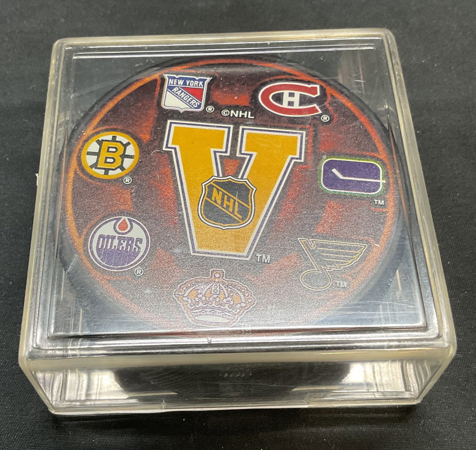 Official NHL Vintage Logo Hockey Puck: Officially licensed NHL vintage team logo hockey puck. Vancouver Canucks, Montreal Canadiens, Boston Bruins, Edmonton Oilers, New York Rangers, St Louis Blues, and Los Angeles Kings. Includes acrylic 