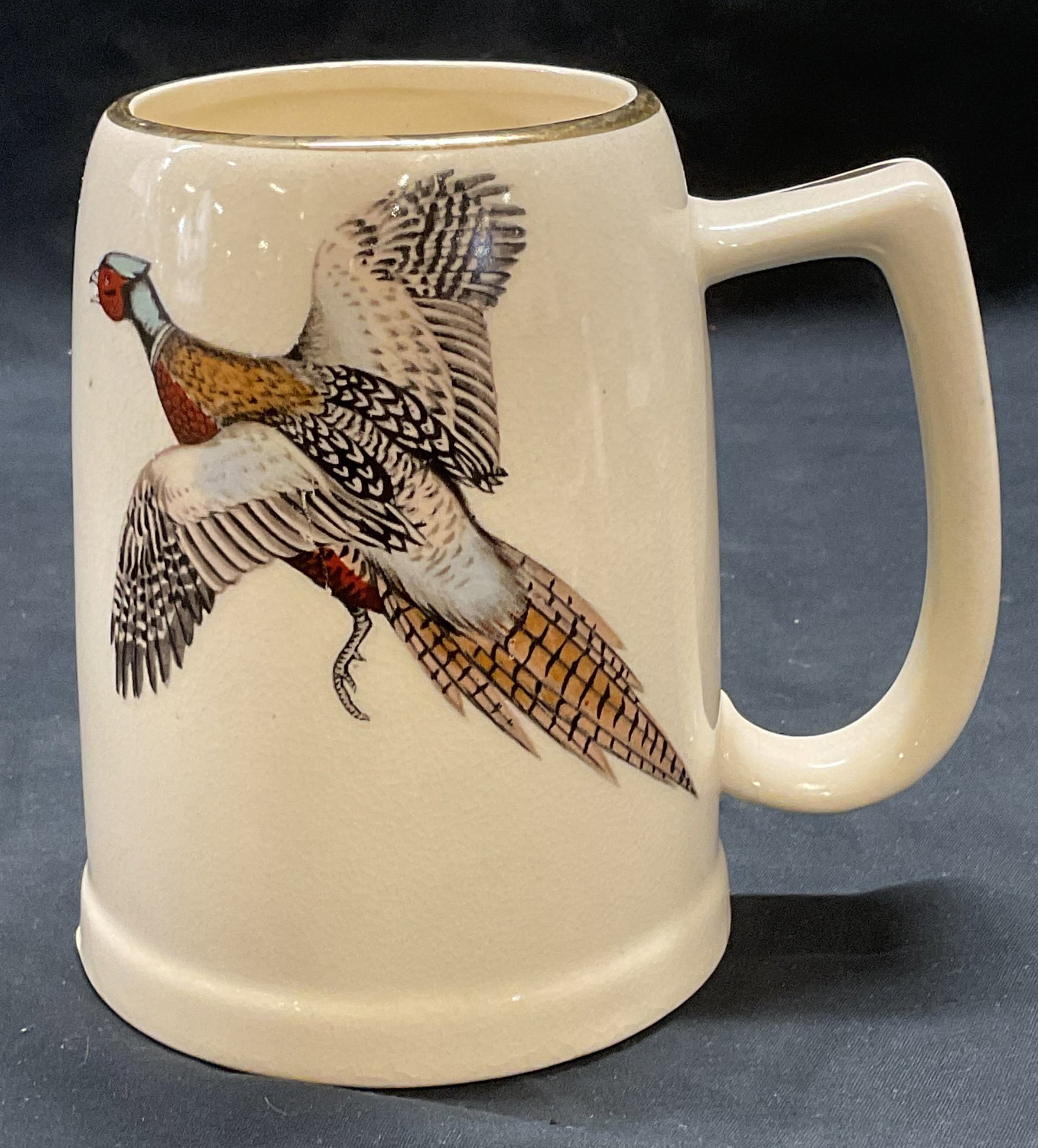 Vintage Ceramic Pheasant Beer Mug: Vintage ceramic beer mug. Pheasant motif. Text on reverse. Measures approx. 4 x 5.25 inches. Surface wear including crazing observed. Beer mug, ceramic mug, pheasant mug, mug, tableware, tail accessor