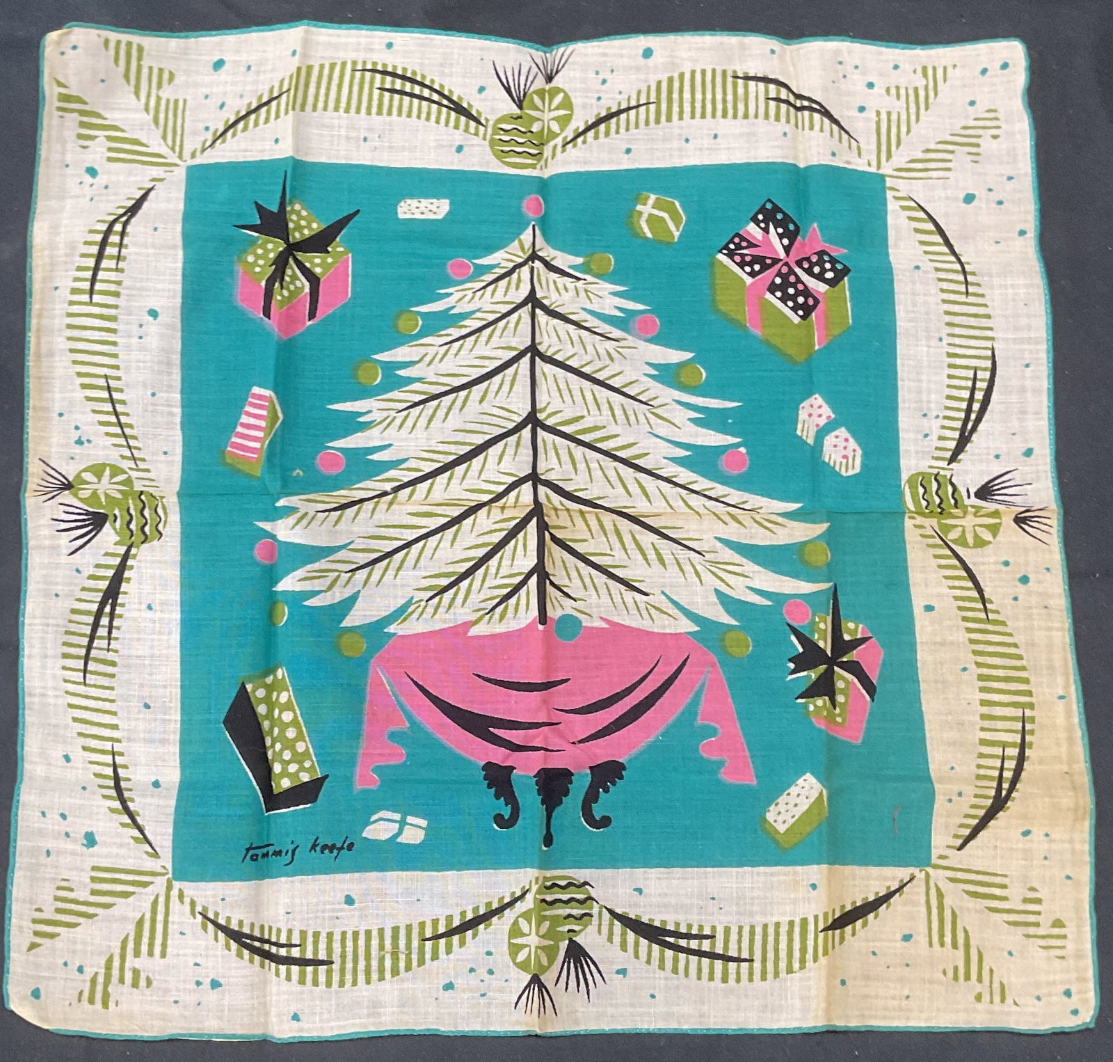 Tammis Keefe Christmas Tree Holiday Handkerchief: Vintage Tammis Keefe holiday handkerchief with Christmas tree motif. Signed on lower left. Measures approx. 13 x 12.5 inches. Material feels like cotton. Wear to material including blemishes observed.