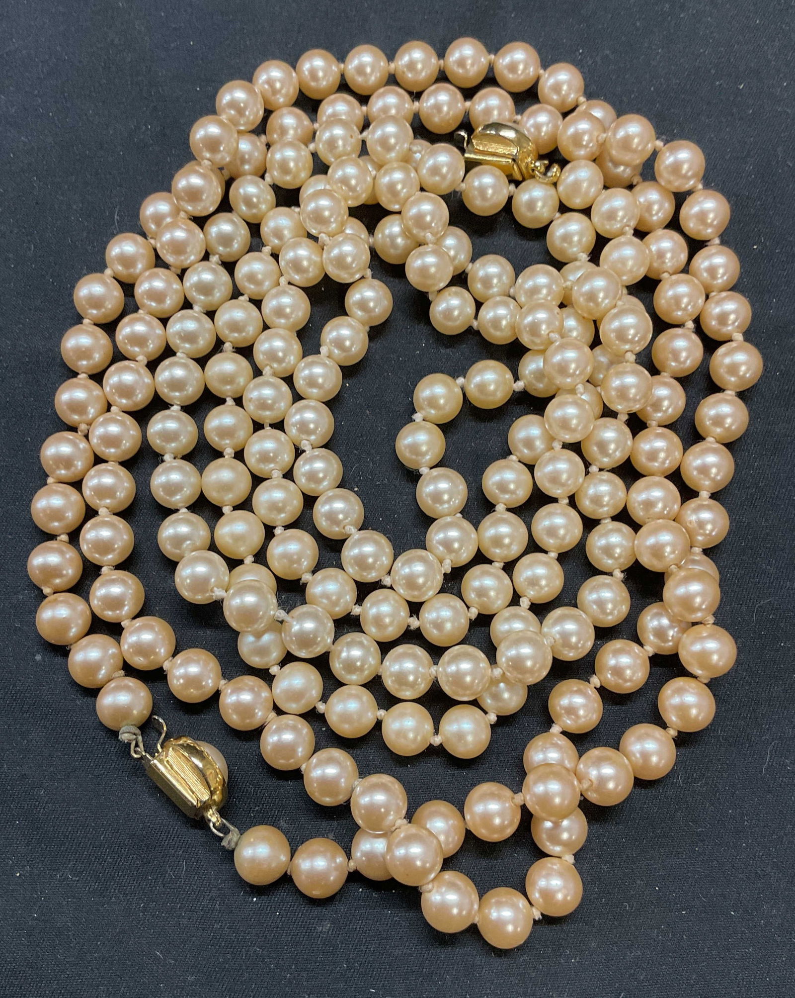 Lot 2 Vintage Faux Pearl Beaded Necklaces: Lot of 2 vintage faux pearl beaded necklaces on double knotted strings. Longer necklace drop length approx. 18 inches. Necklaces have weight. Some surface wear to both pieces including scratching obse