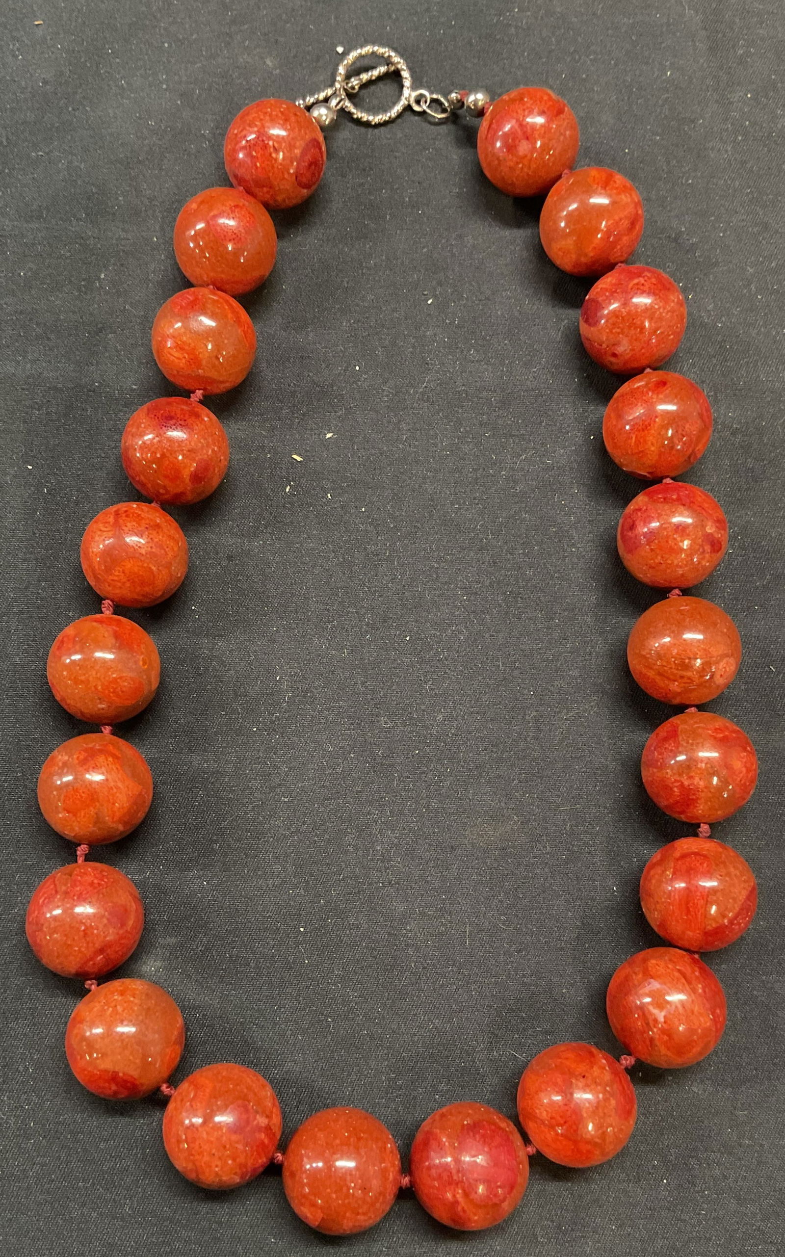 Vintage Faux Red Coral Beaded Necklace: Vintage faux red coral round beaded necklace. Double knotted string. Drop length approx. 9 inches. Some surface wear including scratching observed. Jewelry, estate jewelry, costume jewelry, cocktail j