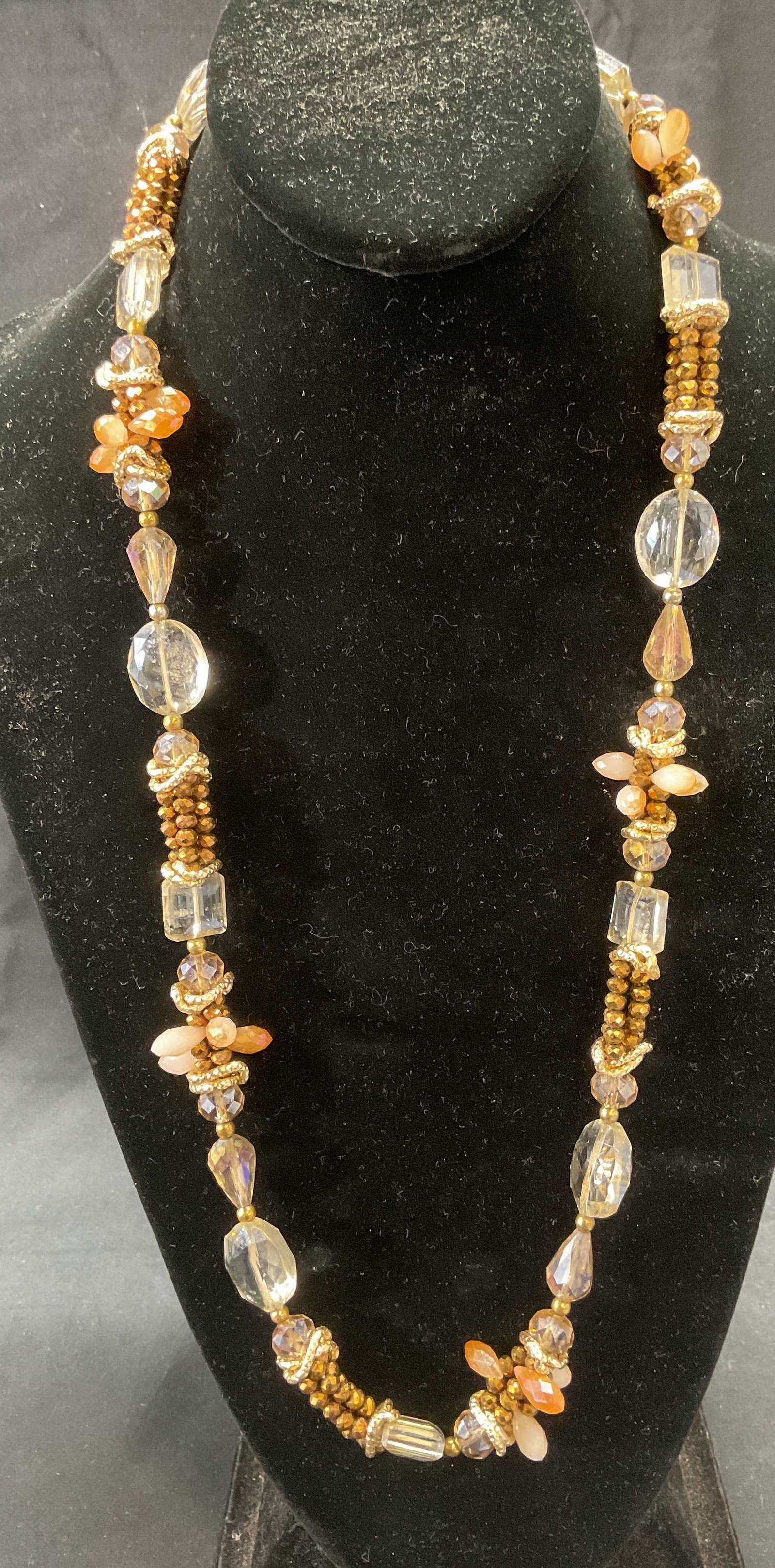 Vintage Gold Tone Glass Crystal Beaded Necklace: Vintage gold tone crystal beaded necklace with faceted colorless and gold tone glass crystals. Drop length approx. 13.5 inches. Necklace has weight. Some surface wear including scratching observed. Je
