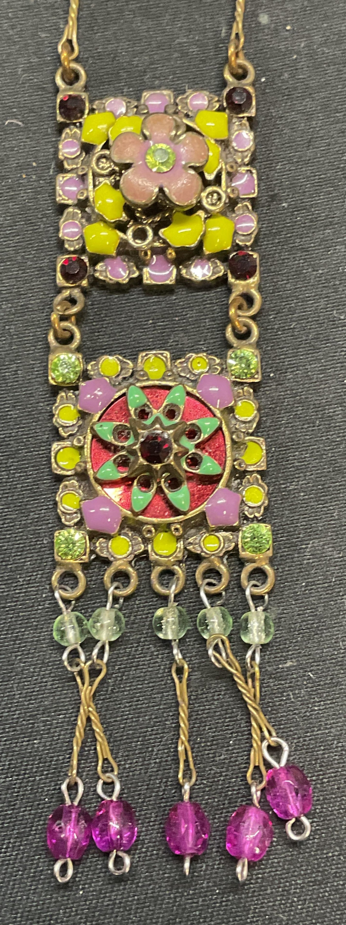 Vintage Satellite Crystal Flower Pendant Necklace: Vintage Satellite gold tone pendant necklace. Multicolor crystal and enamel decorated flower motifs pendant. Signed on hangtag. Drop length approx. 7.5 inches. Pendant measures approx. 2.75 inches lon