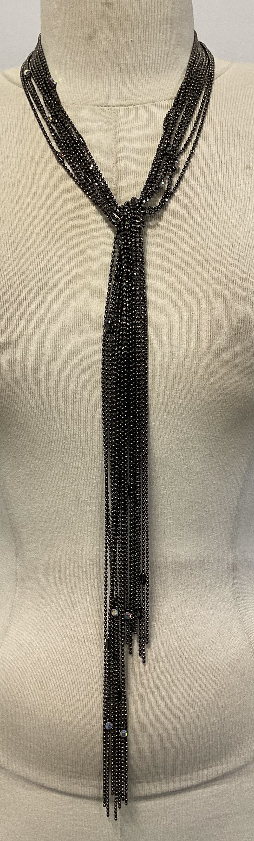 Gunmetal Grey Crystal Lariat Necklace: Gunmetal grey multi chain lariat necklace with crystal decoration. Drop length approx. 23 inches. Some surface wear including scratching observed. 2 crystals need replacement. Jewelry, estate jewelry,