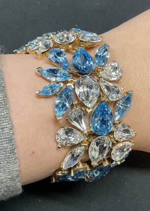 Vintage Todd Anthony Blue Crystal Bracelet: Vintage Todd Anthony gold tone blue and colorless crystal wide band bracelet. Signed on clasp. Measures approx. 8 inches long. Includes box. One piece needs replacement near clasp. Jewelry, costume je