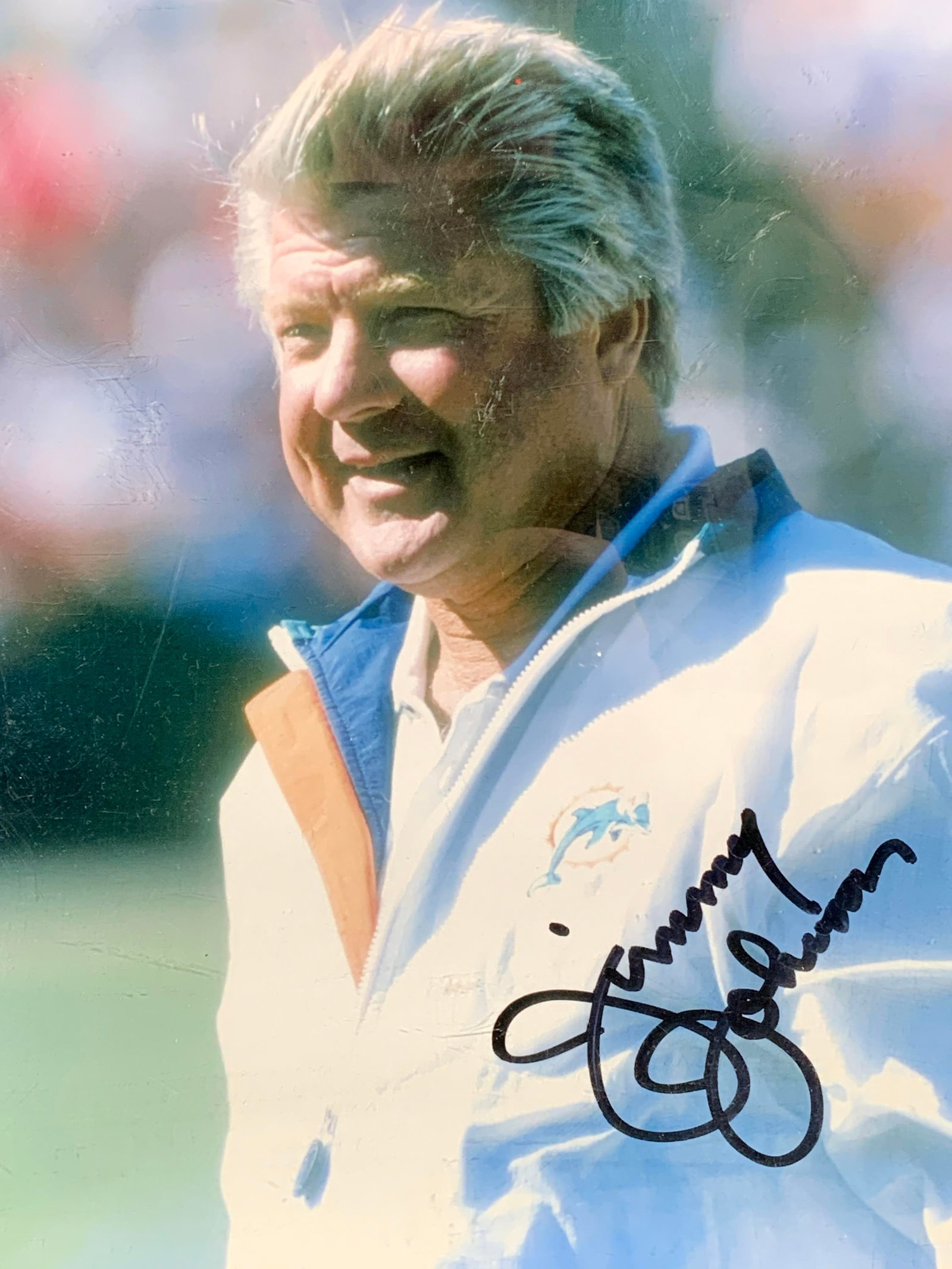 Autographed Jimmy Johnson Photograph NFL Football: Signed photograph. Signed by Jimmy Johnson, subject of the photograph. Photograph shows Johnson when he coached for the Miami Dolphins NFL team from 1996-1999. He has won two super bowls as coach of t