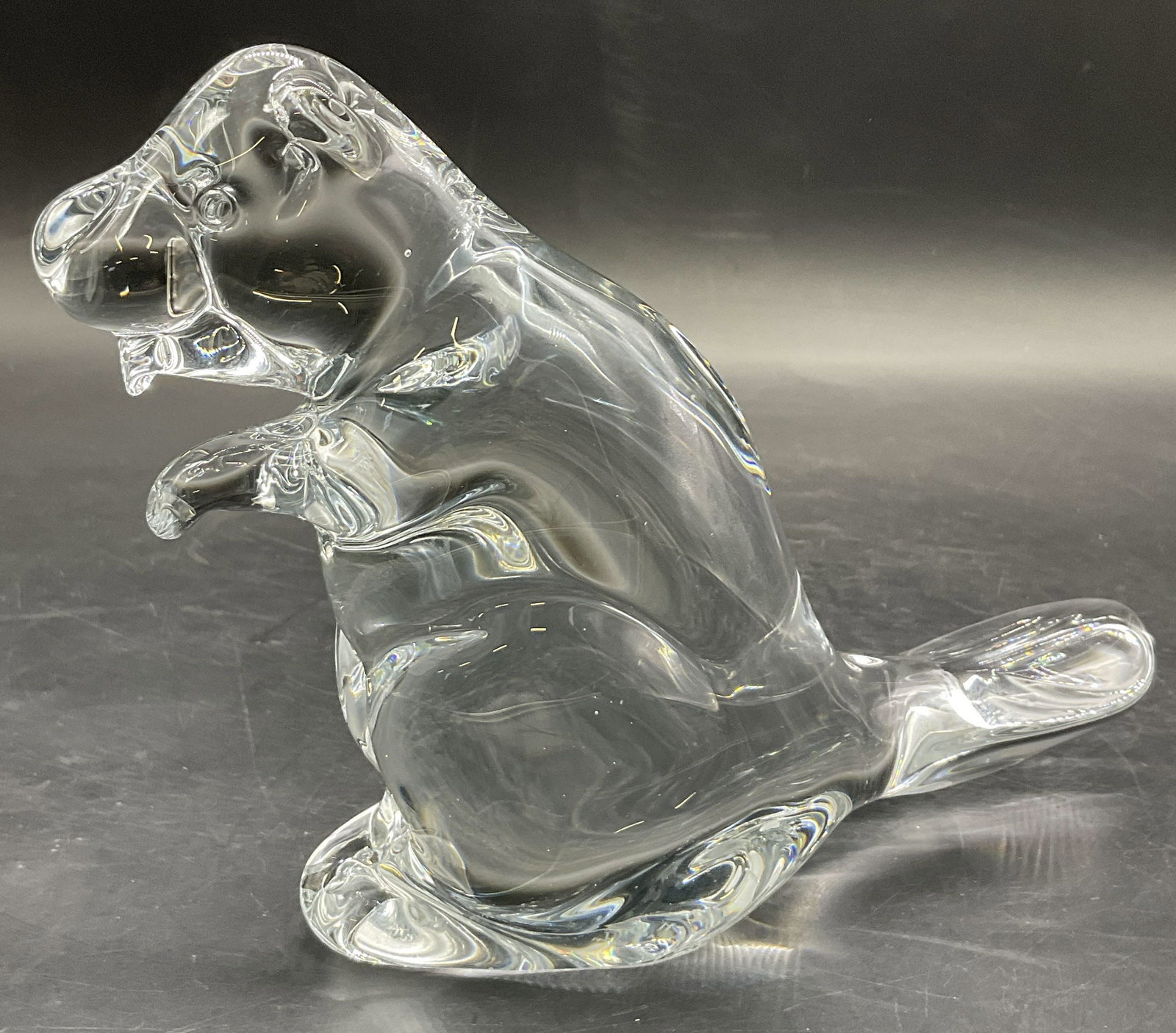 FM RONNEBY Crystal Beaver Figural, Sweden: A crystal beaver figural. Underside signed FM RONNEBY SWEDEN. Measures approx. 5H x 7W in. Measured at widest point. Surface wear present. Rough edge to lip. FM RONNEBY Crystal, FM RONNEBY Beaver, FM 