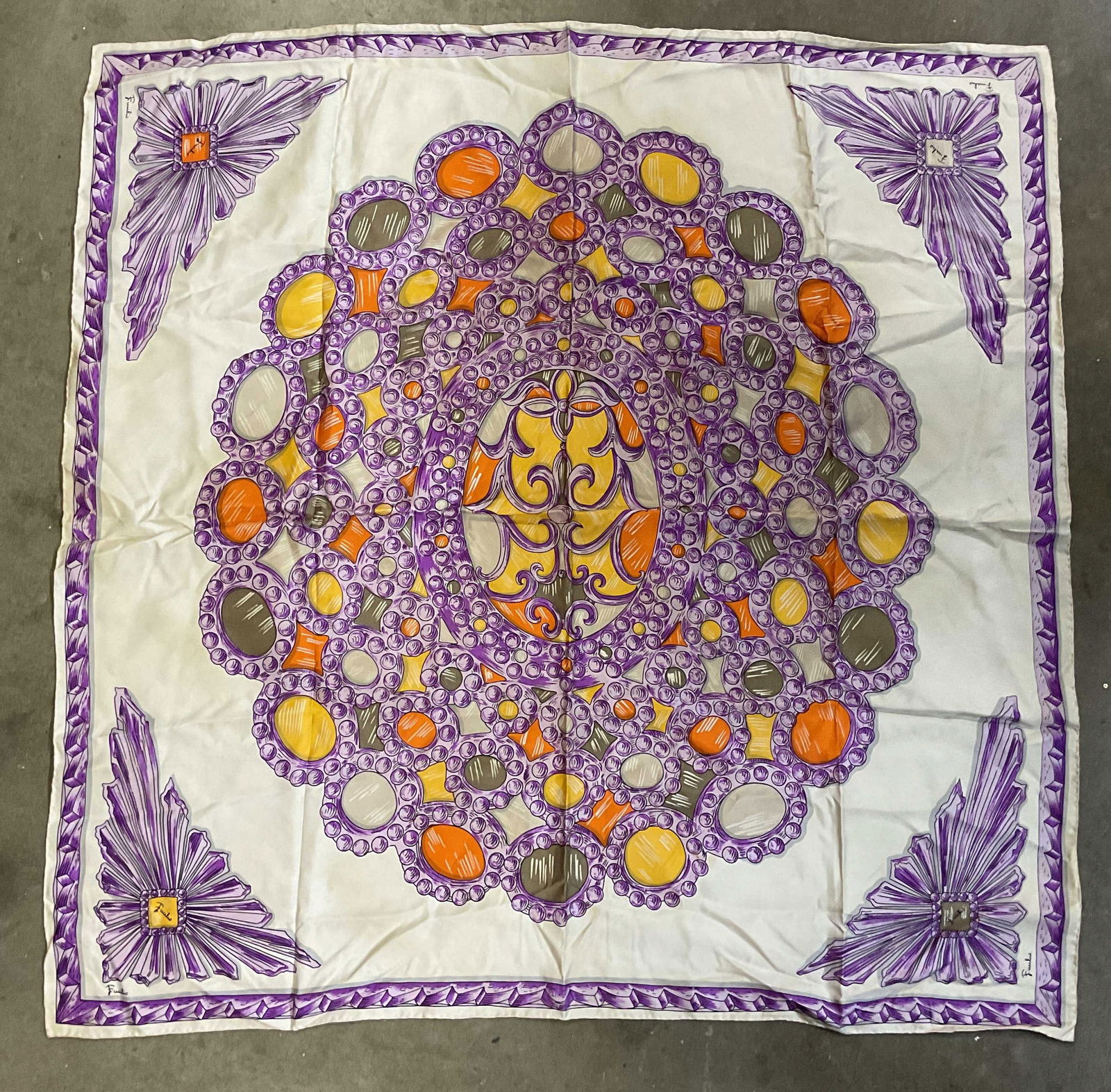 Emilio Pucci Purple Silk Gem Brooch Scarf, Italy: Vintage Emilio Pucci silk scarf with graphic print gemstone brooch motif in white, purple, and orange. Signed on corners and label. Made in Italy for Saks Fifth Avenue. Hand rolled edges. Measures app
