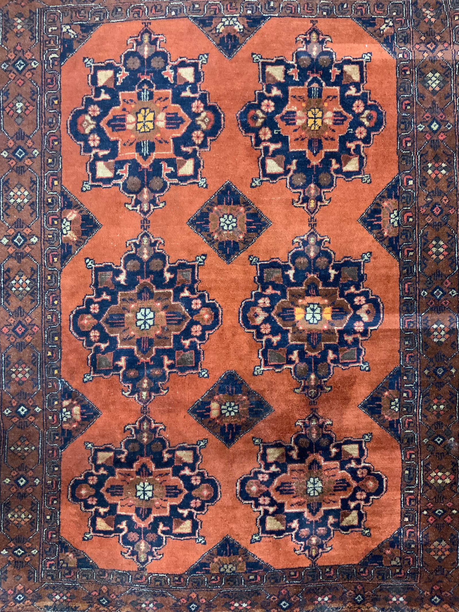 Vintage Handmade KAZAK Wool Rug: Rug is handmade and wool. Piece is vintage . Rug has intricate multi toned geometric detail. Rug has knotted tan toned fringes. KAZAK rug. Piece measures approximately 60 inches long 40 inches wide. R