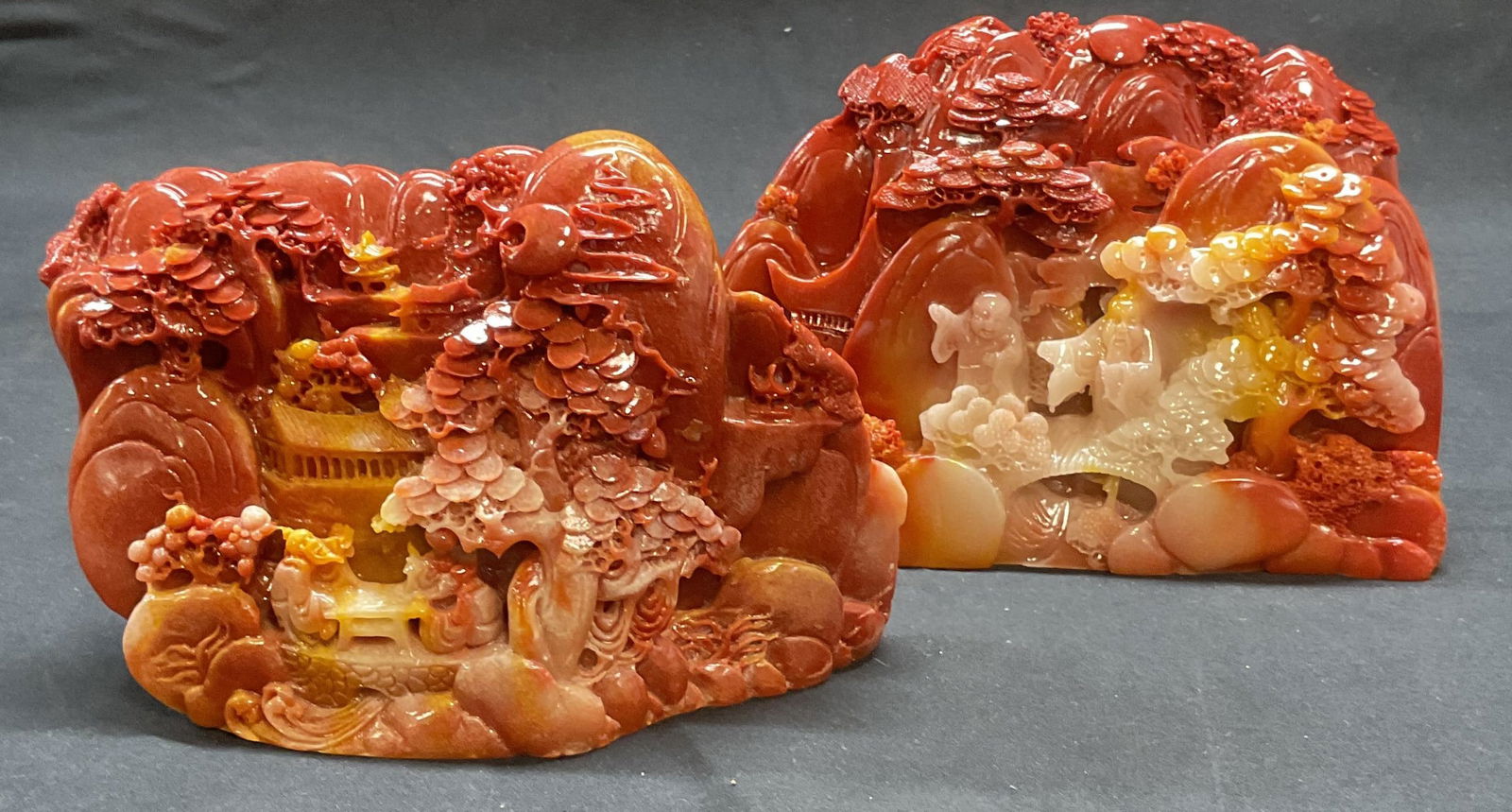 Lot 2 Carved Resin Asian Figures & Landscape Decor: Lot of 2 pieces carved red and yellow toned resin faux stone decorative objects. Figural and landscape designs. Sizes vary slightly. Larger piece measures approx. 6.5 x 2.5 x 4.5 inches. Pieces have w