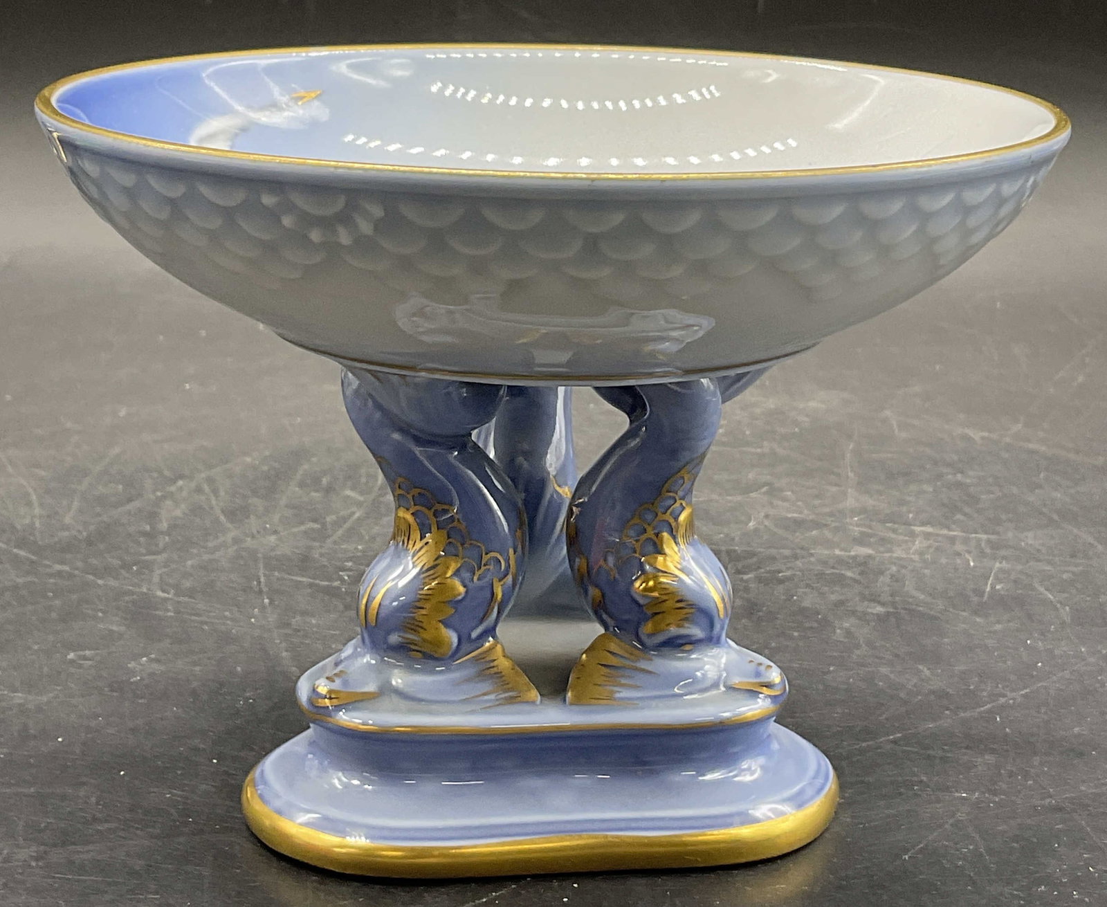 Bing & Grondahl Porcelain Seagull Pedestal Compote: Bing & Grondahl BG Seagull Motif Porcelain Round Compote Dish with Fish Pedestal. Underside signed B&G, DANMARK, 66. Primarily blue hues with gilt line work. Measures approx. 5.5W x 4H in. Surface wea