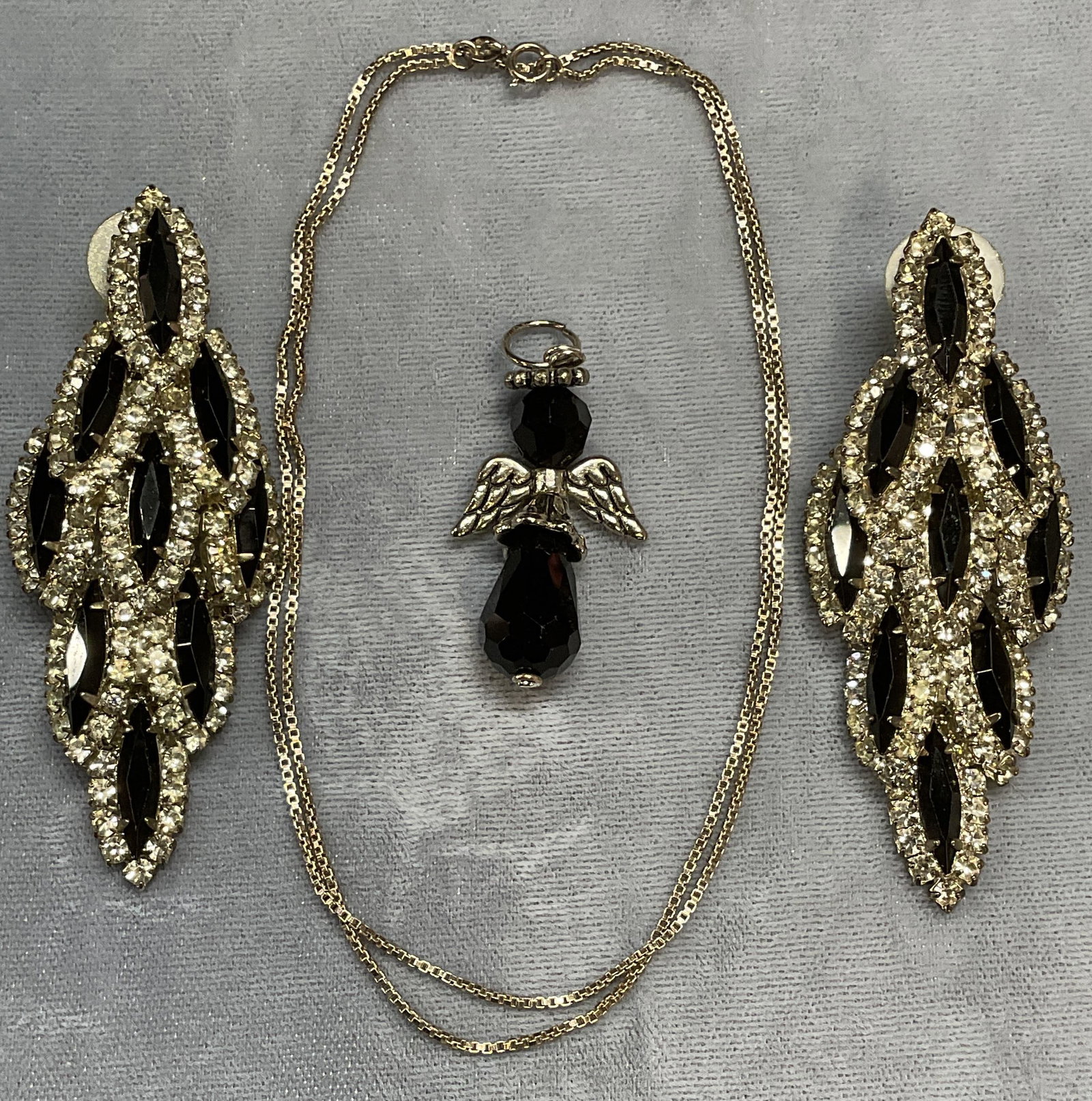 3 Sterling Silver Chain Necklace, Angel Pendant +: Lot of 3 jewelry pieces. Vintage sterling silver box chain necklace. Marked 925 on clasp. Drop length approx. 10 inches. Total weight .09 ozt. Silver tone and black crystal angel motif pendant. Measur