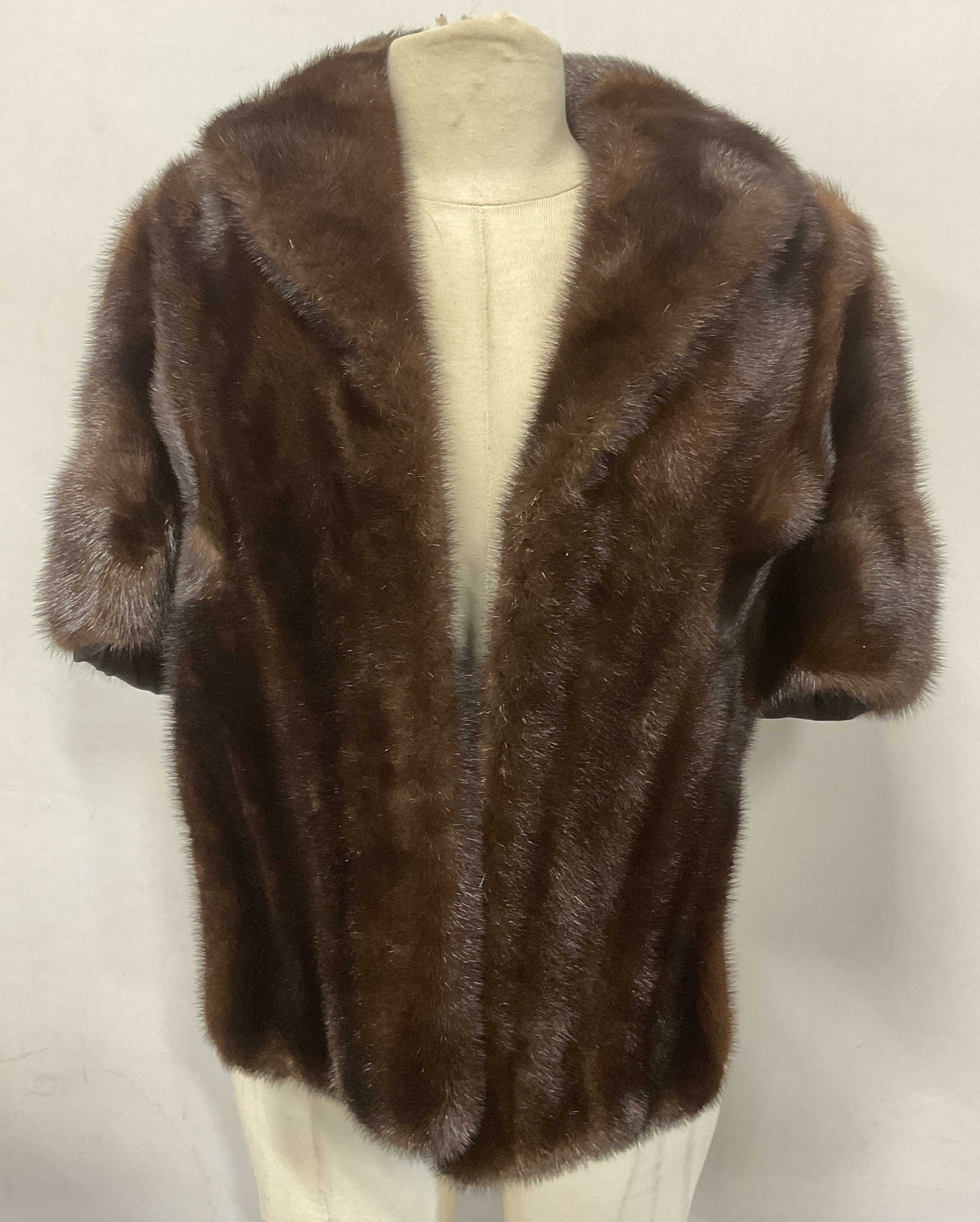 Vintage Hirschs Brown Fur Cape: Vintage Hirschs Fur Shop brown fur cape. Measures approx. 20 inches across chest, 22 inches from shoulder to hem (front). Fully lined, monogram on lining. Includes satin garment bag. Some wear to mate
