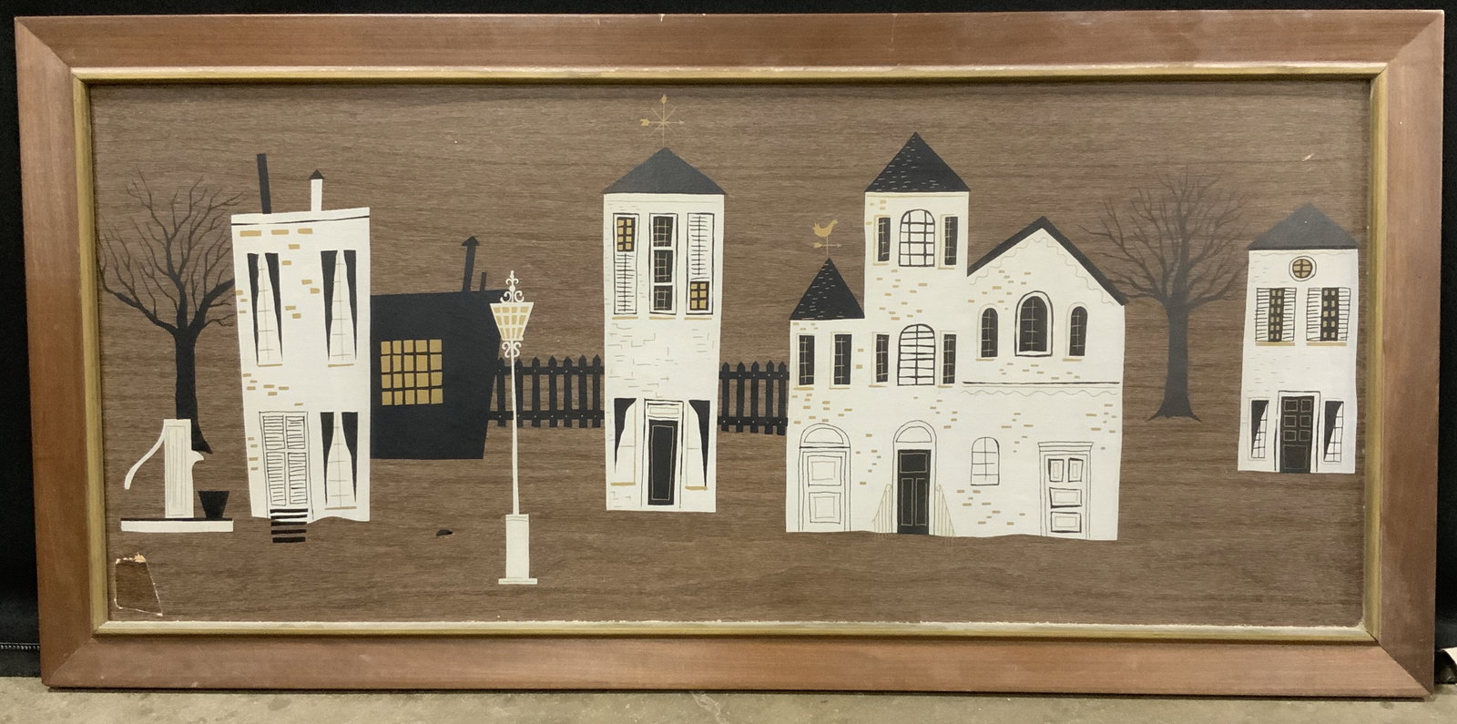 Framed Town Houses Lithograph on Wood: Lithograph on wood. Subject depicts a line of white stoned townhouses and a street lamp. Framed in a brown wooden frame. Frame measures approx. 43.5 W x 21 H in. Window measures approx. 39 W x 17 H in