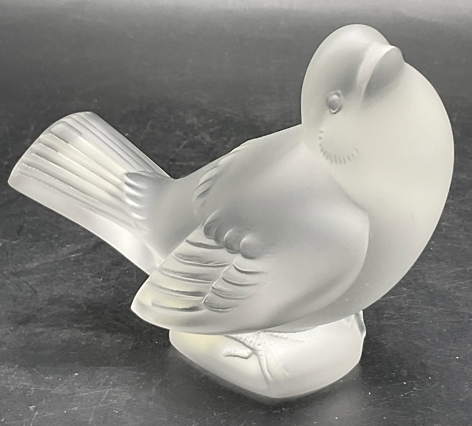LALIQUE FRANCE Signed Crystal Sparrow Bird Figural: LALIQUE FRANCE Signed Crystal Sparrow Bird Figural. Reverse is signed LALIQUE FRANCE. Stickers to underside reads Cristal Lalique Paris, Made in France, and Moqueur 11.606. Measures approx. 3.25H x 4W